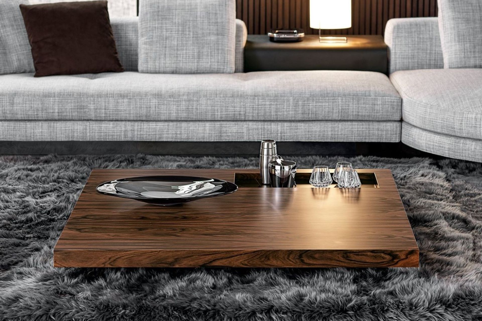 Glass and tableware can be permanent decor items for your coffee table, readily available when you need them, as seen here on the sophisticated Boteco Coffee Table by Minotti.
