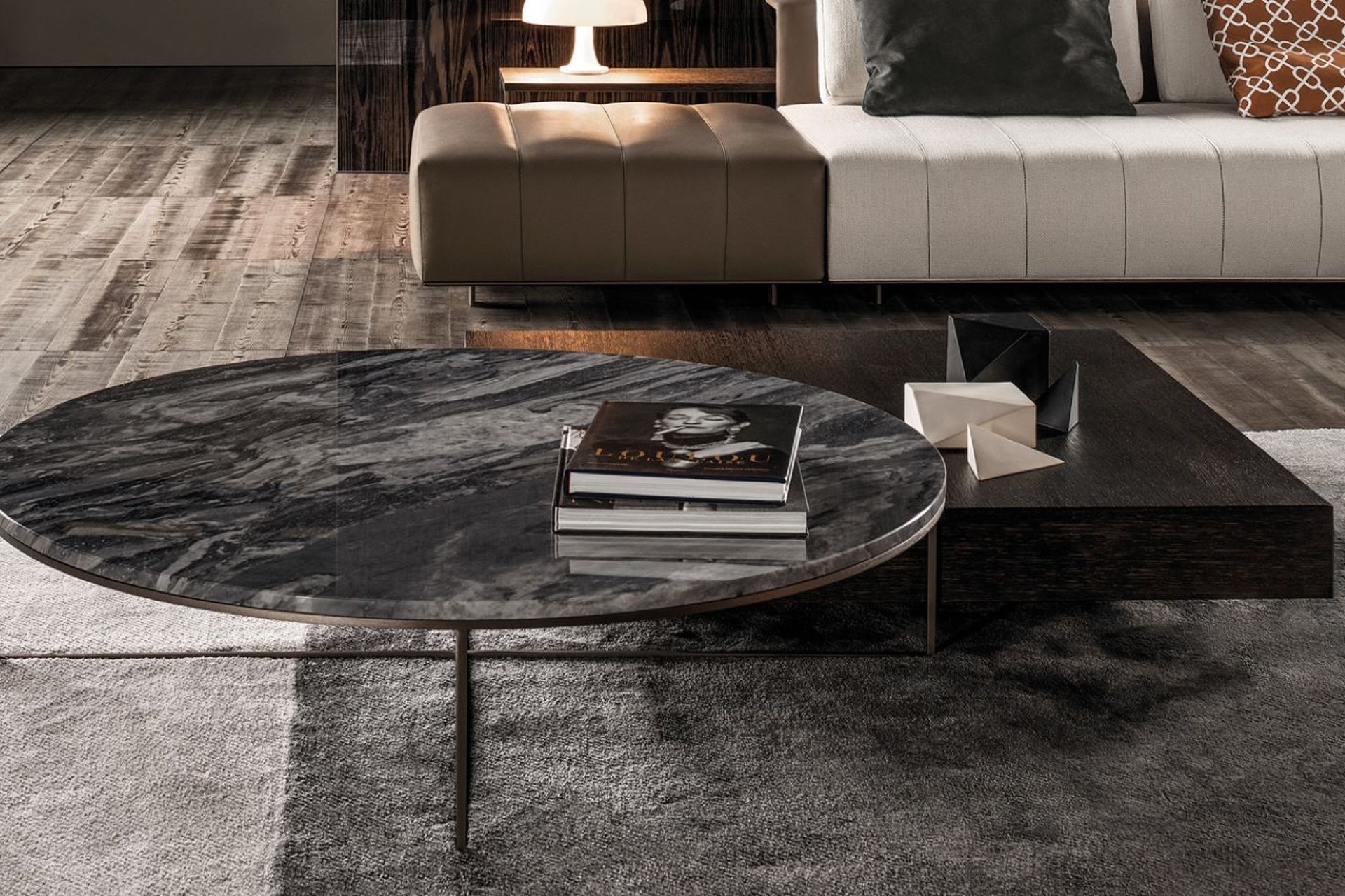 Coffee table books with stylish covers can enhance the theme of your interior styling, as seen here on the exquisite Calder Bronze Coffee Table.