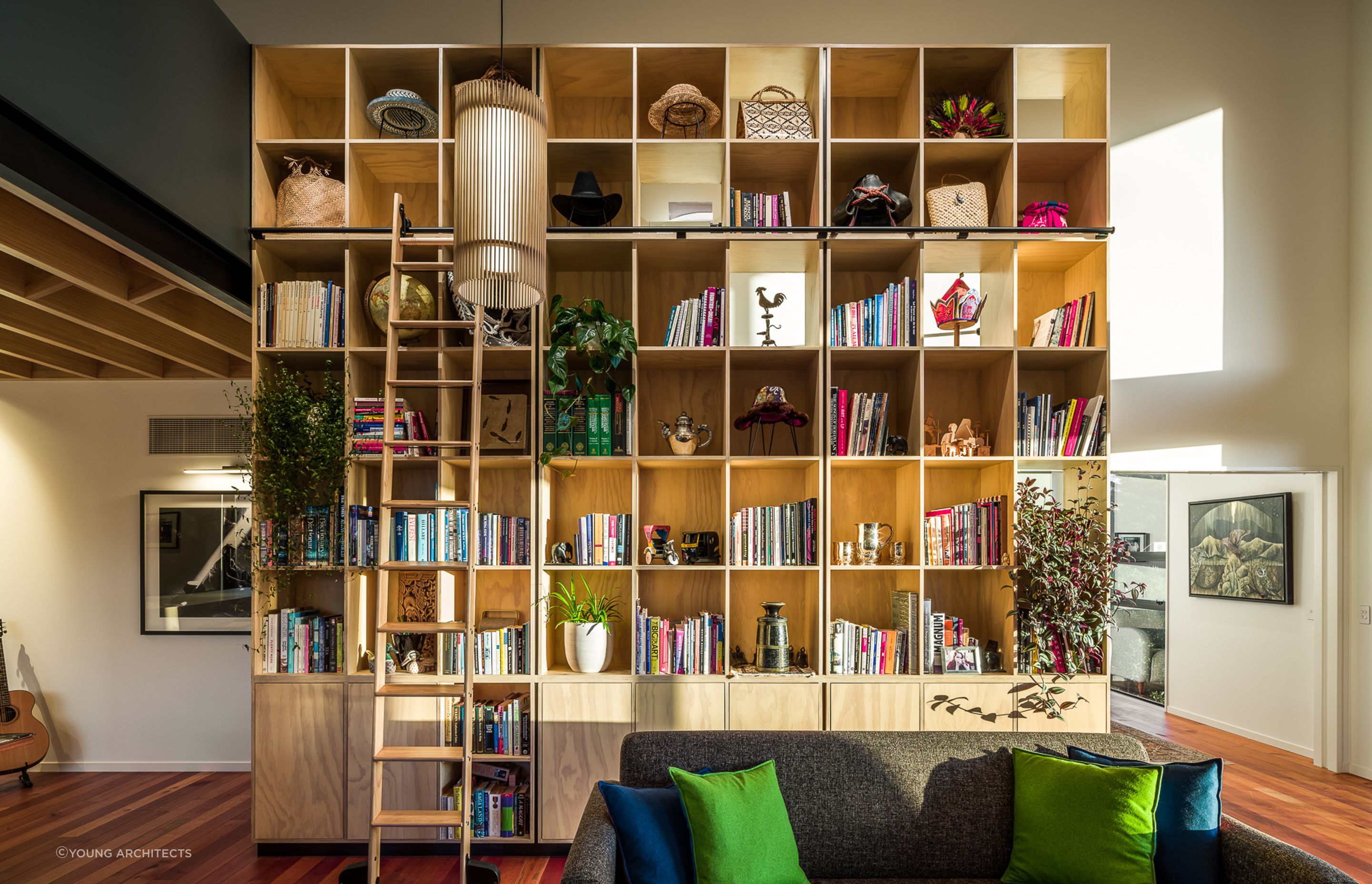 The inclusion of some beautiful pot plants brings tremendous vitality to this impressive bookcase in this home in the Port Hills of Christchurch. Photography: Dennis Rademacher
