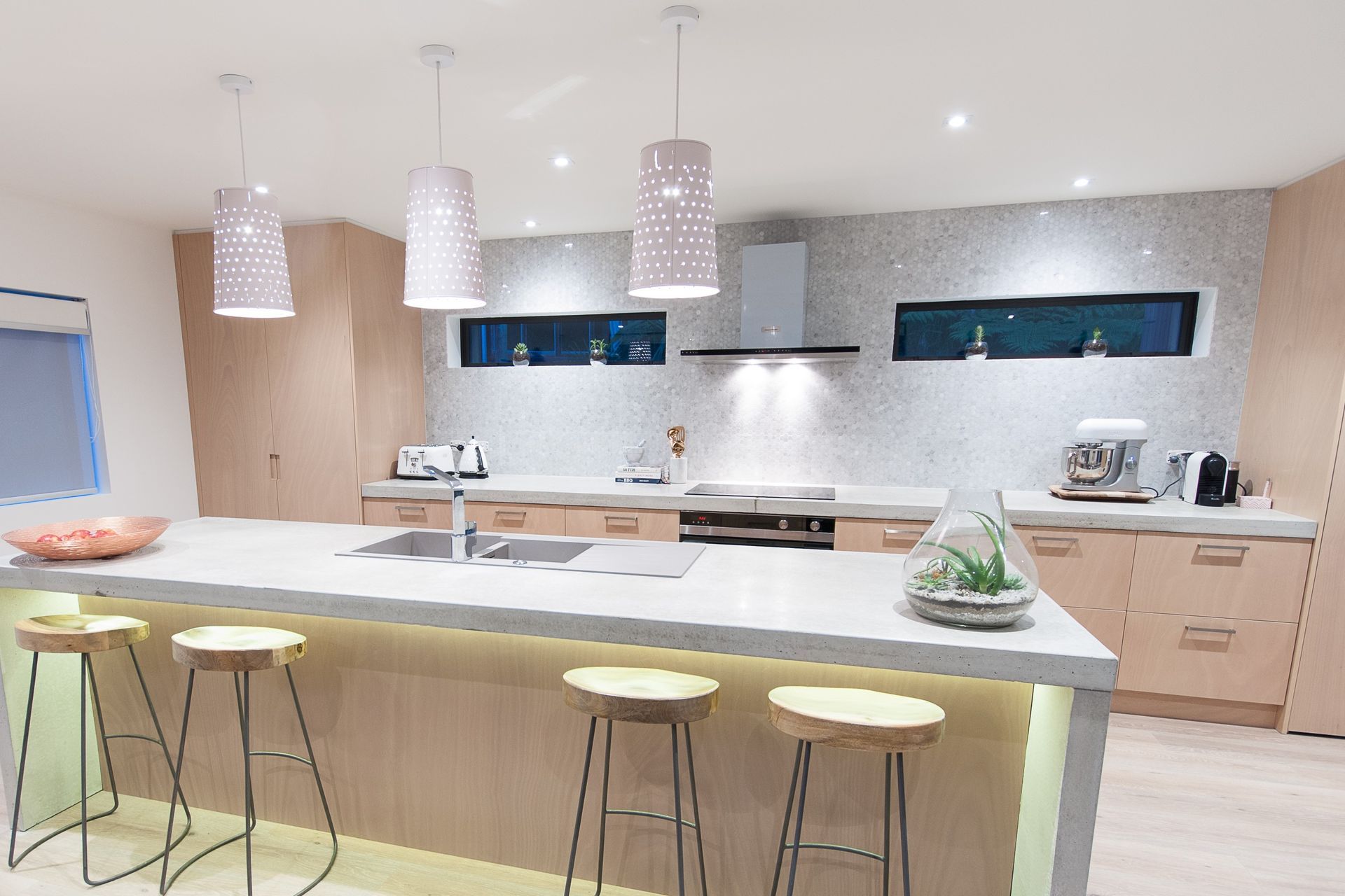Mesmerising shades of grey on the kitchen wall of the inspiring Castor Bay Stream House.
