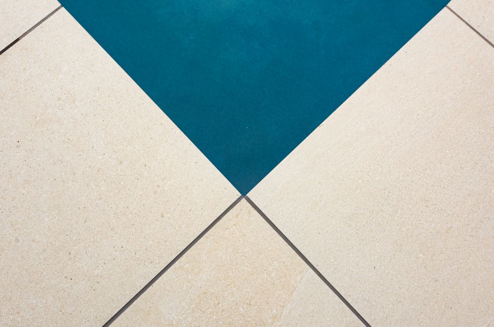 Modernising your pool surrounds with porcelain coping and pavers add both the wow factor and have a very practical place around a pool.