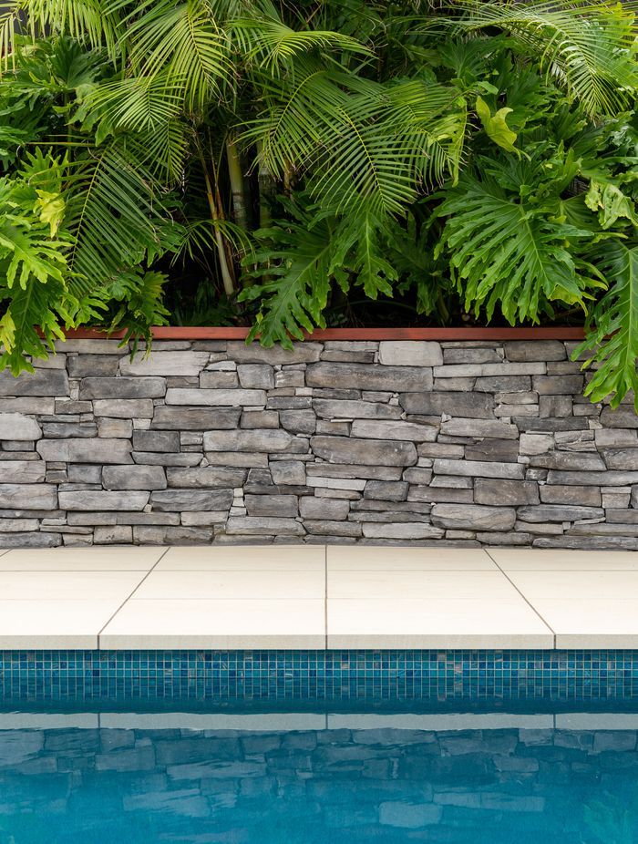 The newly renovated pool area by Auckland Inground Pools complements the existing garden area well.