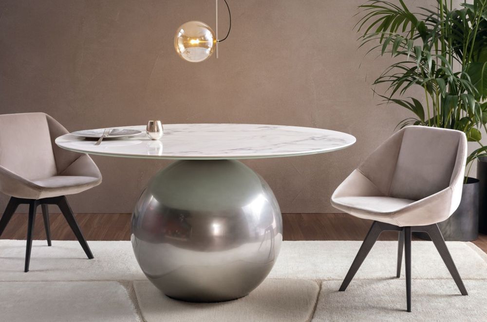 The combination of a spherical base and marble table top make for a compelling furnishing with the Circus Dining Table by Bonaldo.