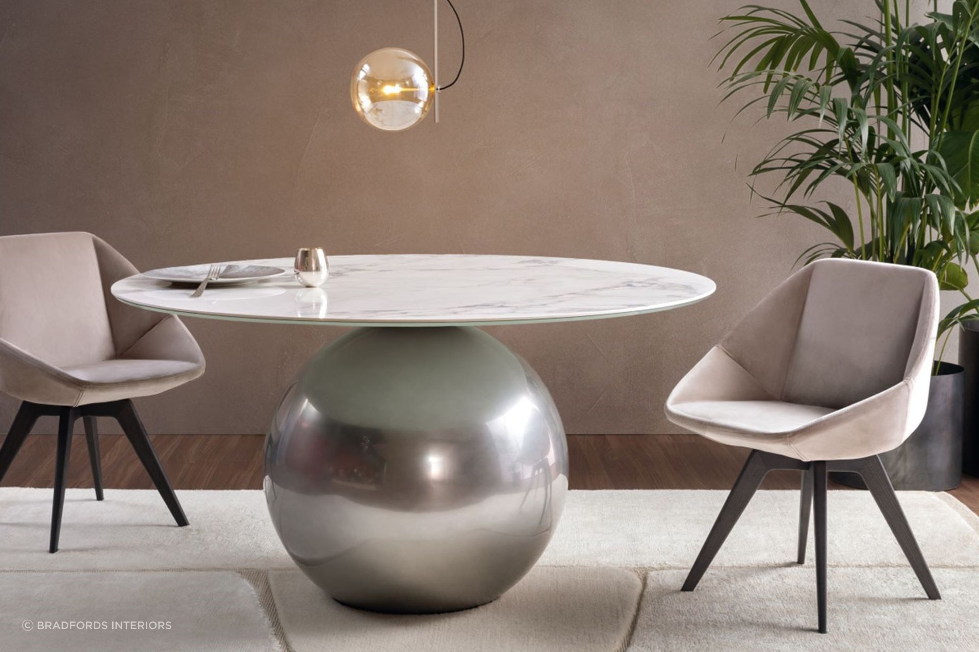 The combination of a spherical base and marble table top make for a compelling furnishing with the Circus Dining Table by Bonaldo.