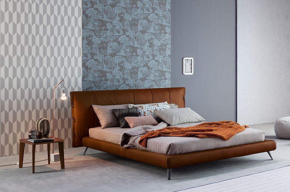 Bedroom furniture with legs allow more light to pass through to preserve the brightness in a space, seen here with the exquisite Cuff Bed by Bonaldo.