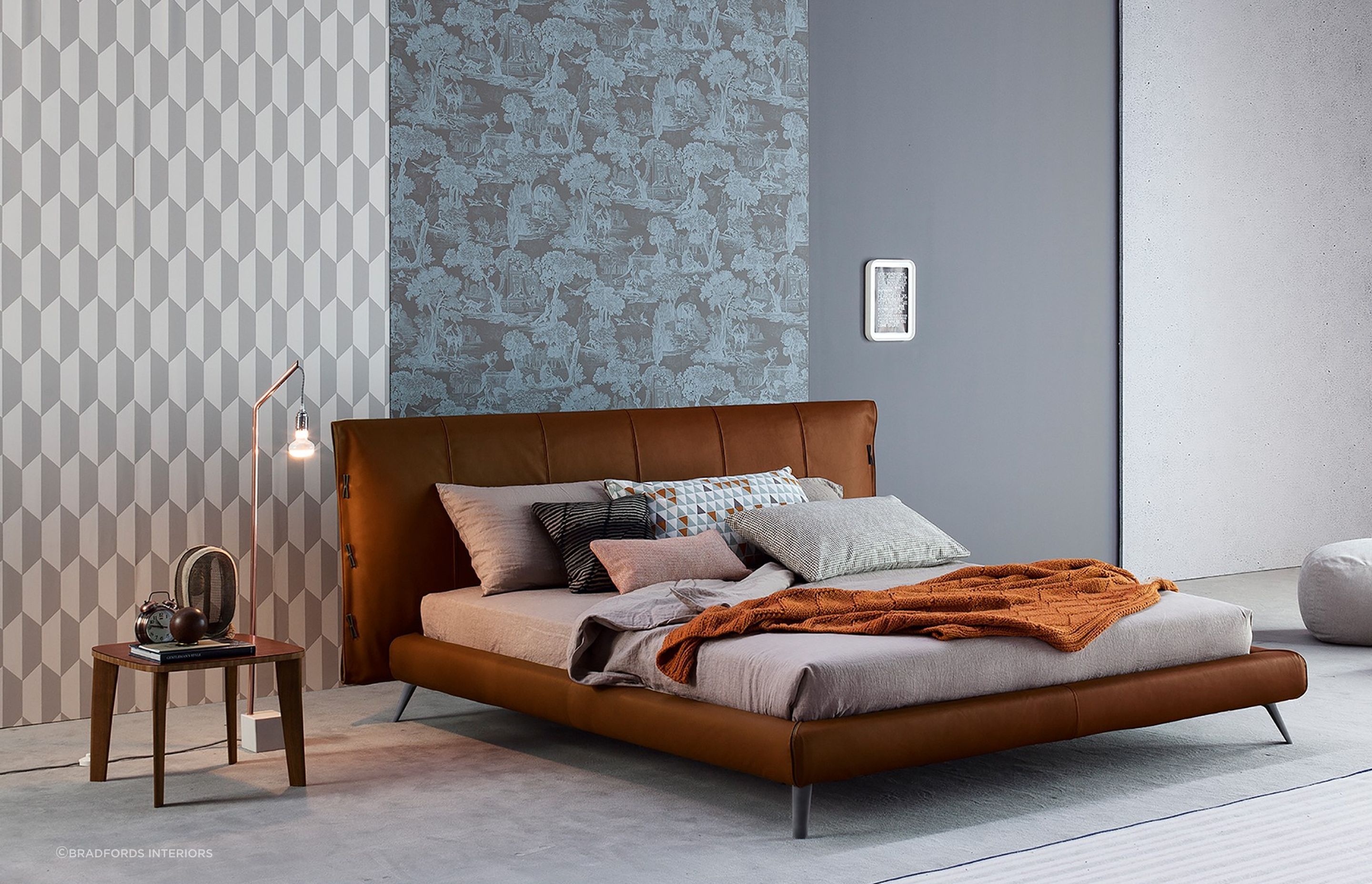 Bedroom furniture with legs allow more light to pass through to preserve the brightness in a space, seen here with the exquisite Cuff Bed by Bonaldo.