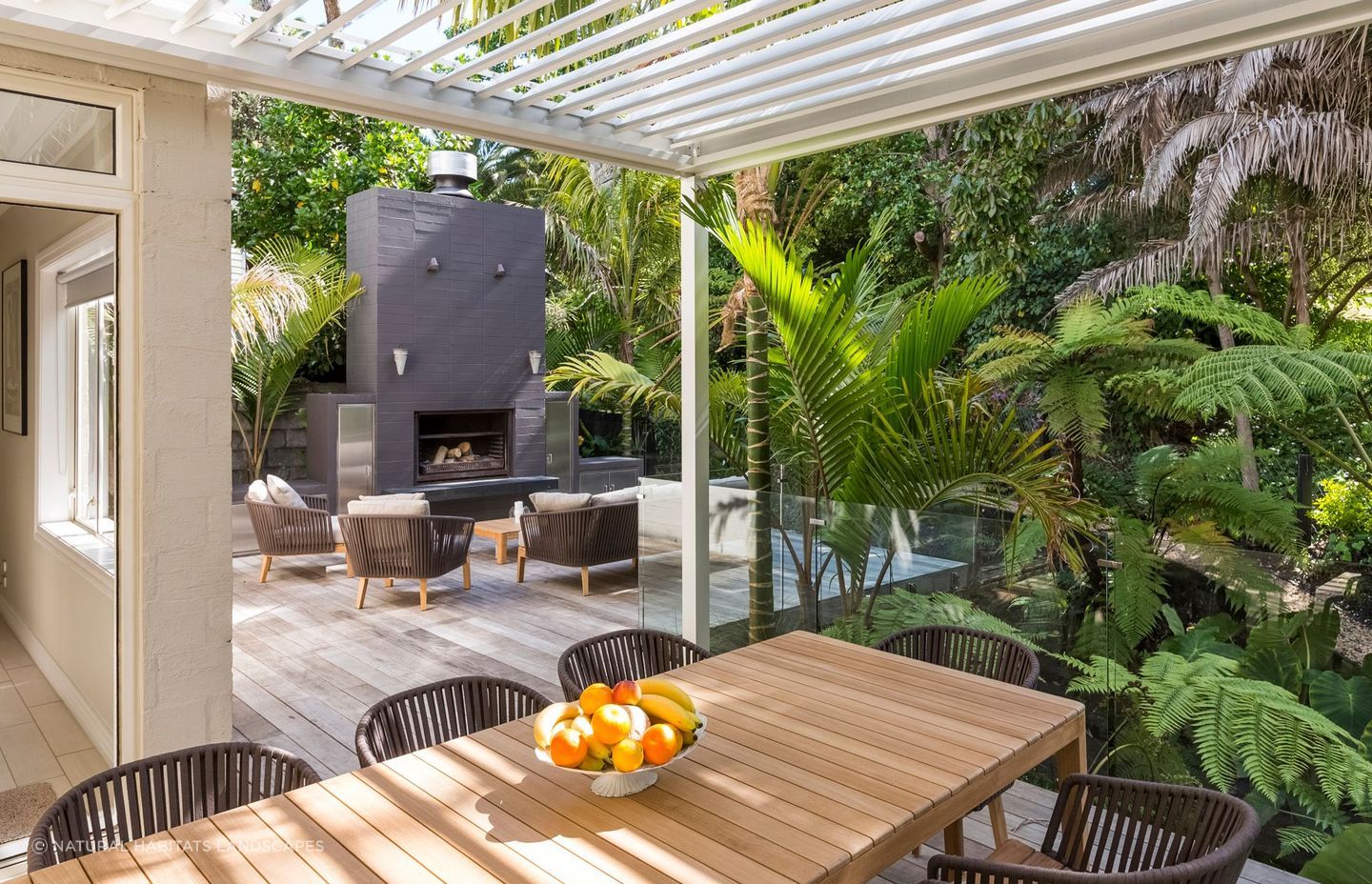 A well-designed outdoor living space, like this one in Remuera, allows you to get the most out of it, even in dense, lush settings like these.