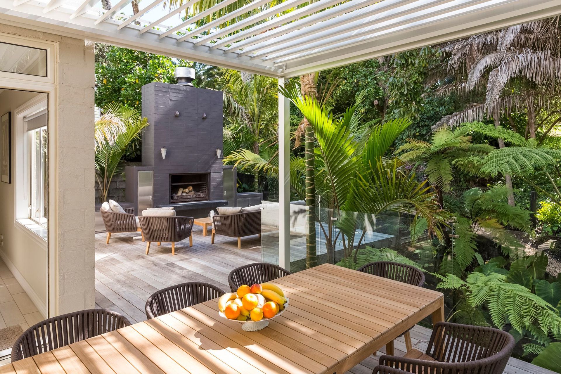 A well-designed outdoor living space, like this one in Remuera, allows you to get the most out of it, even in dense, lush settings like these.
