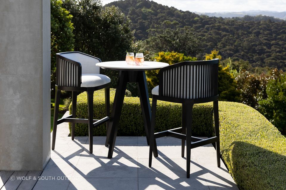 The Largo Bar Stool by Coco Wolf from Wolf &amp; South features an upholstered seat and backrest.