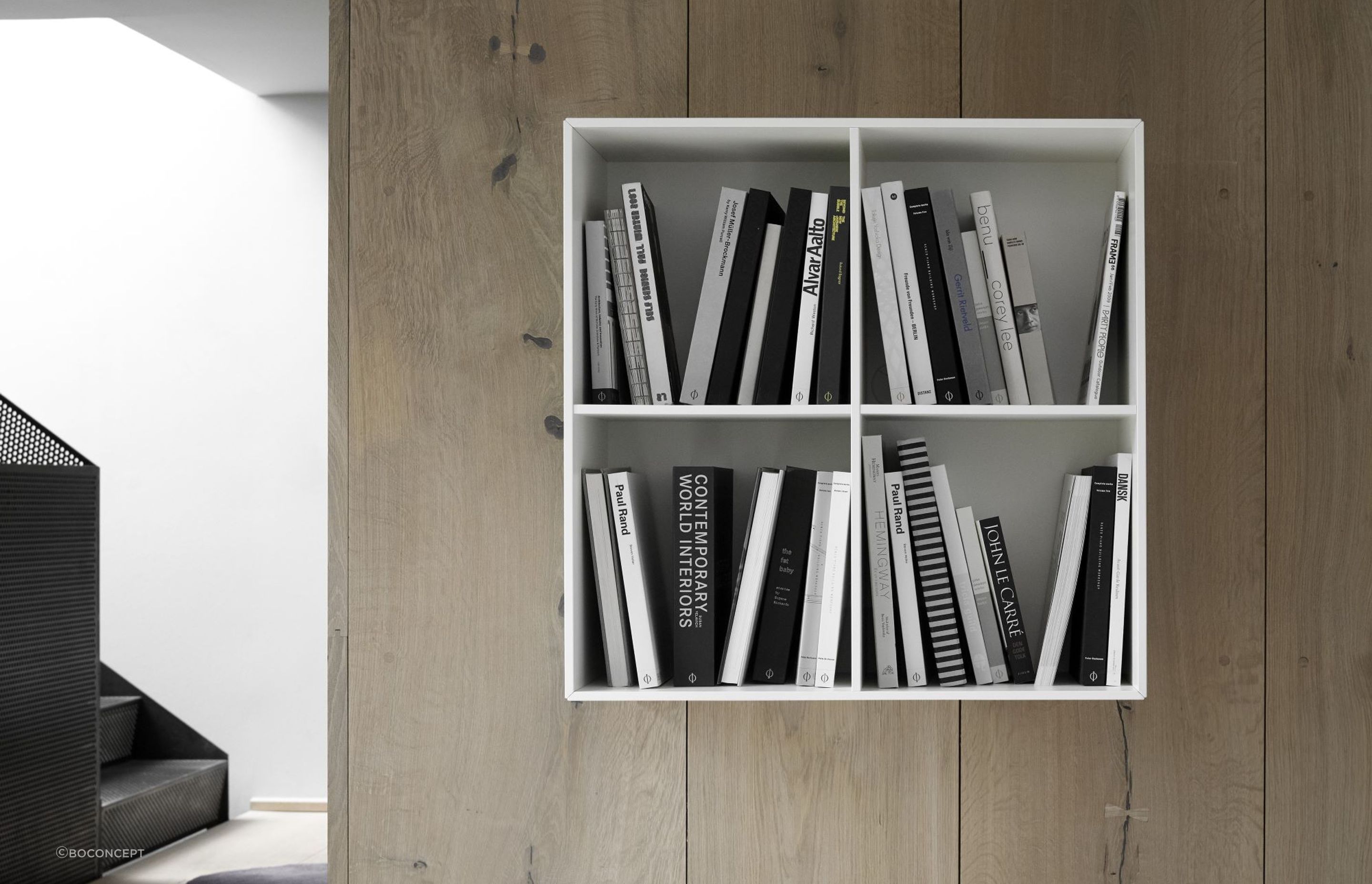 A monochrome approach to colour coordination with the sleek Como 5430 Bookcase, an innovative floating bookshelf system.
