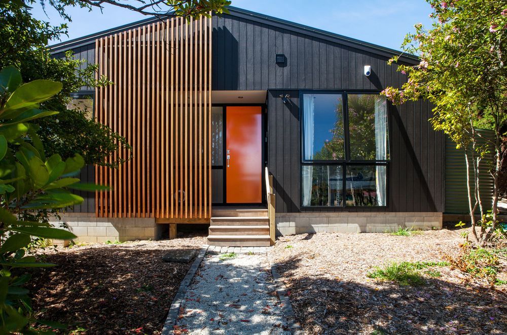 One of Artis Homes first designs. Elegantly symmetrical, the house contains a covered entry area, stepping into a spacious living area.