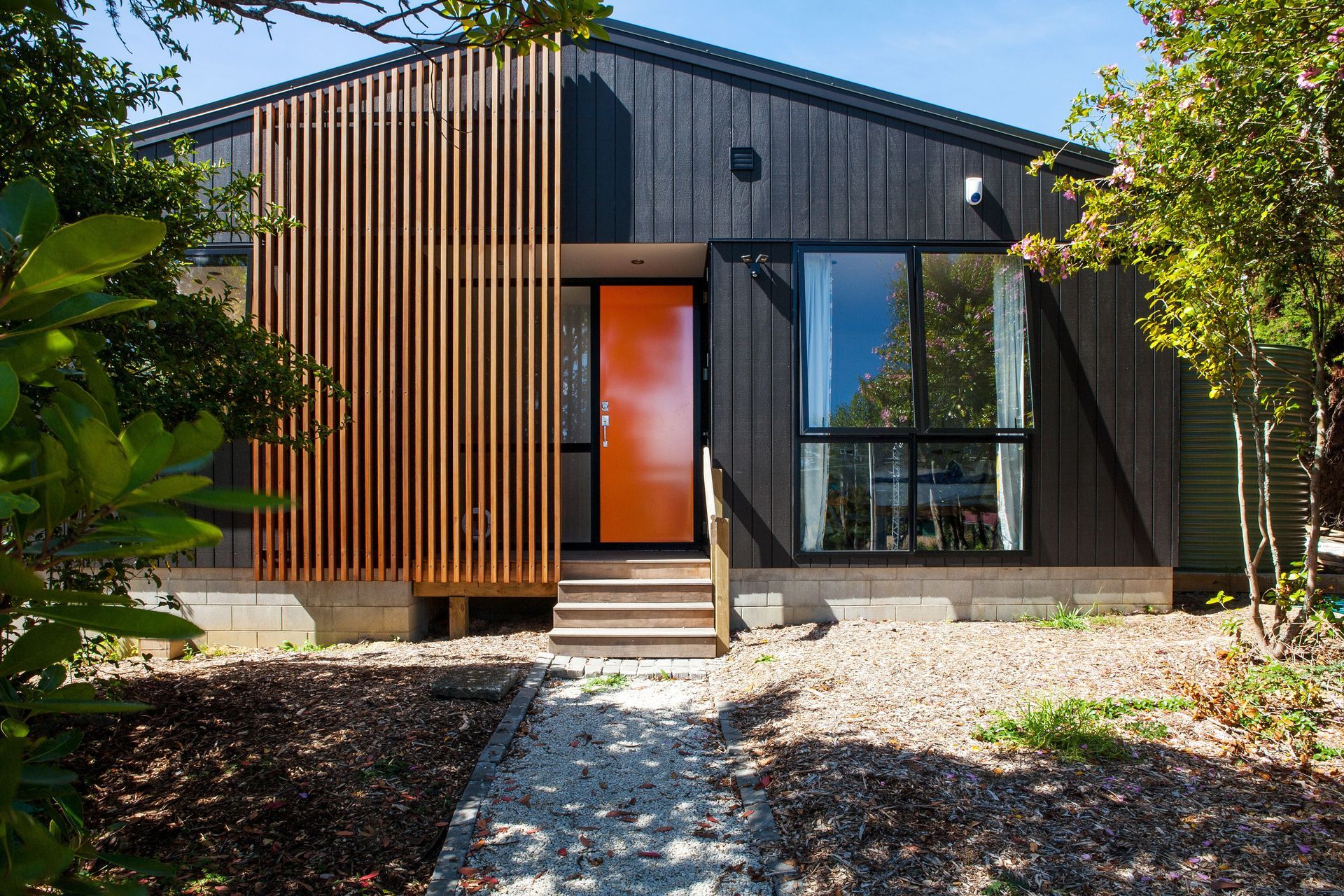 One of Artis Homes first designs. Elegantly symmetrical, the house contains a covered entry area, stepping into a spacious living area.