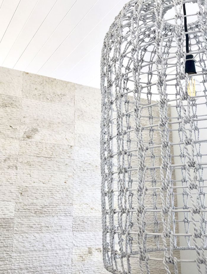 Cream wall cladding in action: modern aesthetic meets warm, soft-textured Crema Alpenia Limestone for an effortlessly contemporary look. Featured product: Cascade Cream Wall Cladding.