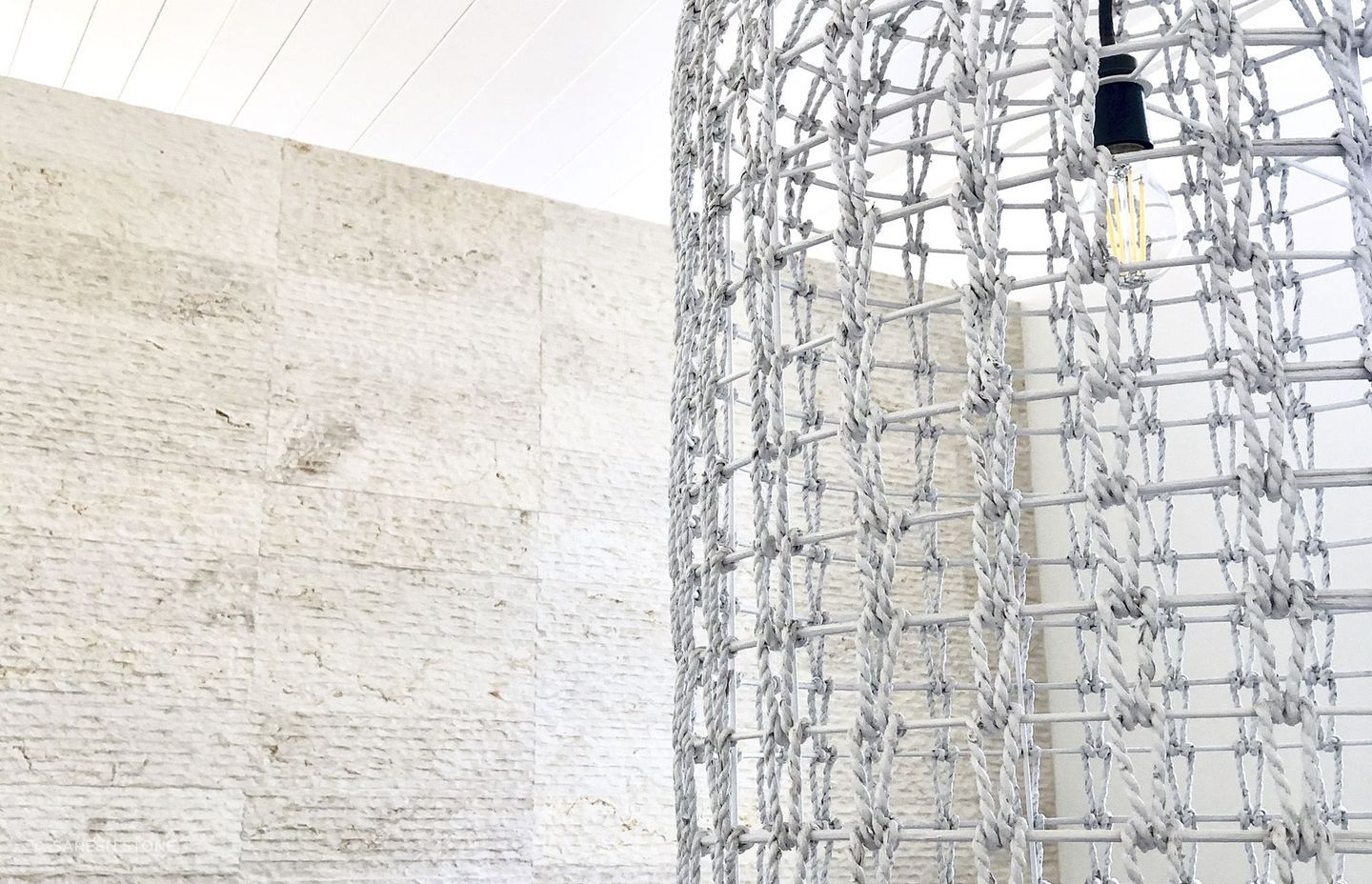 Cream wall cladding in action: modern aesthetic meets warm, soft-textured Crema Alpenia Limestone for an effortlessly contemporary look. Featured product: Cascade Cream Wall Cladding.