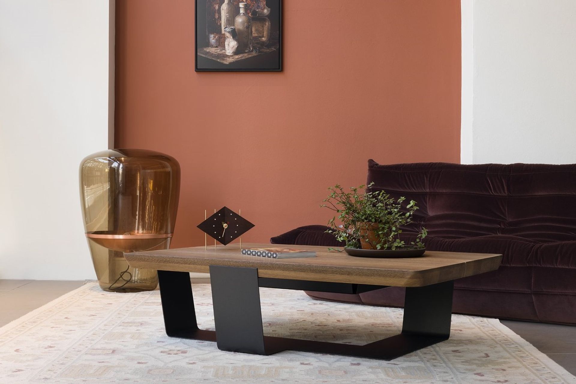 A table clock is a unique way to infuse a bit of character and style into a space, seen here with the ECC Crossings Coffee Table by QLiv