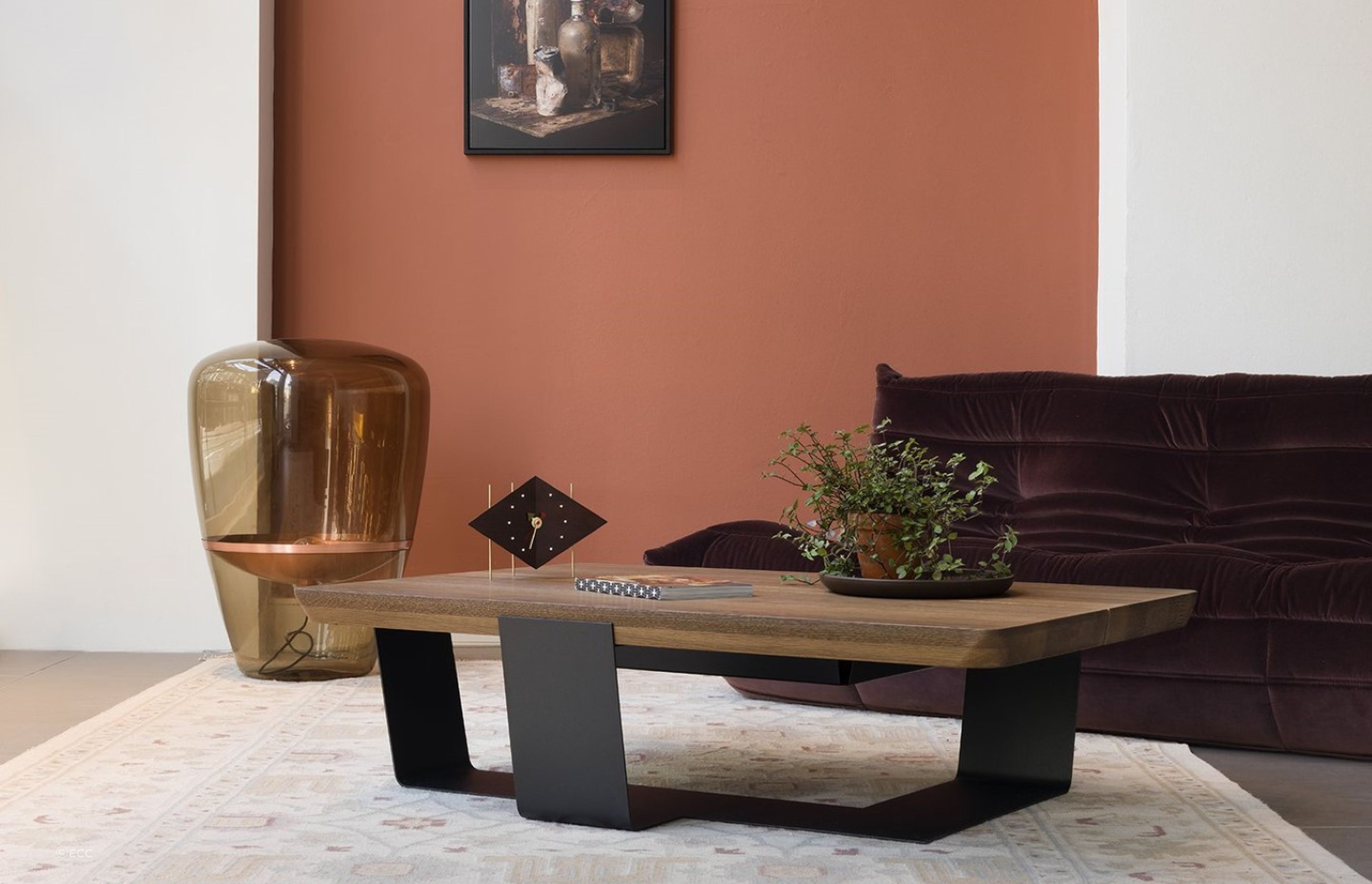 A table clock is a unique way to infuse a bit of character and style into a space, seen here with the ECC Crossings Coffee Table by QLiv