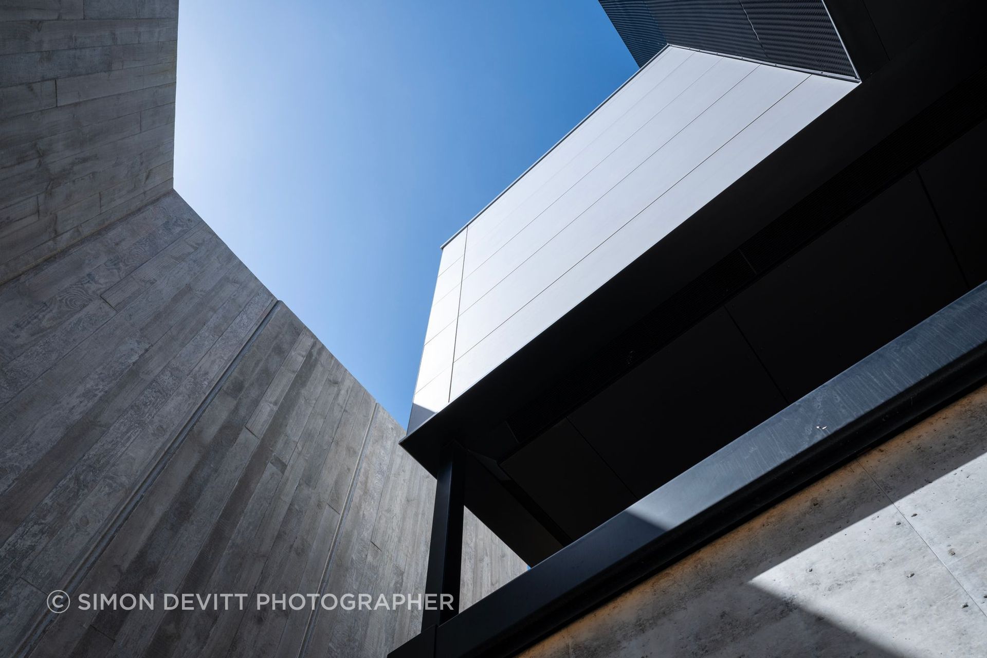 Robust concrete and precise junctions give the house permanence and adaptability, supporting a design intended to outlive the original brief.