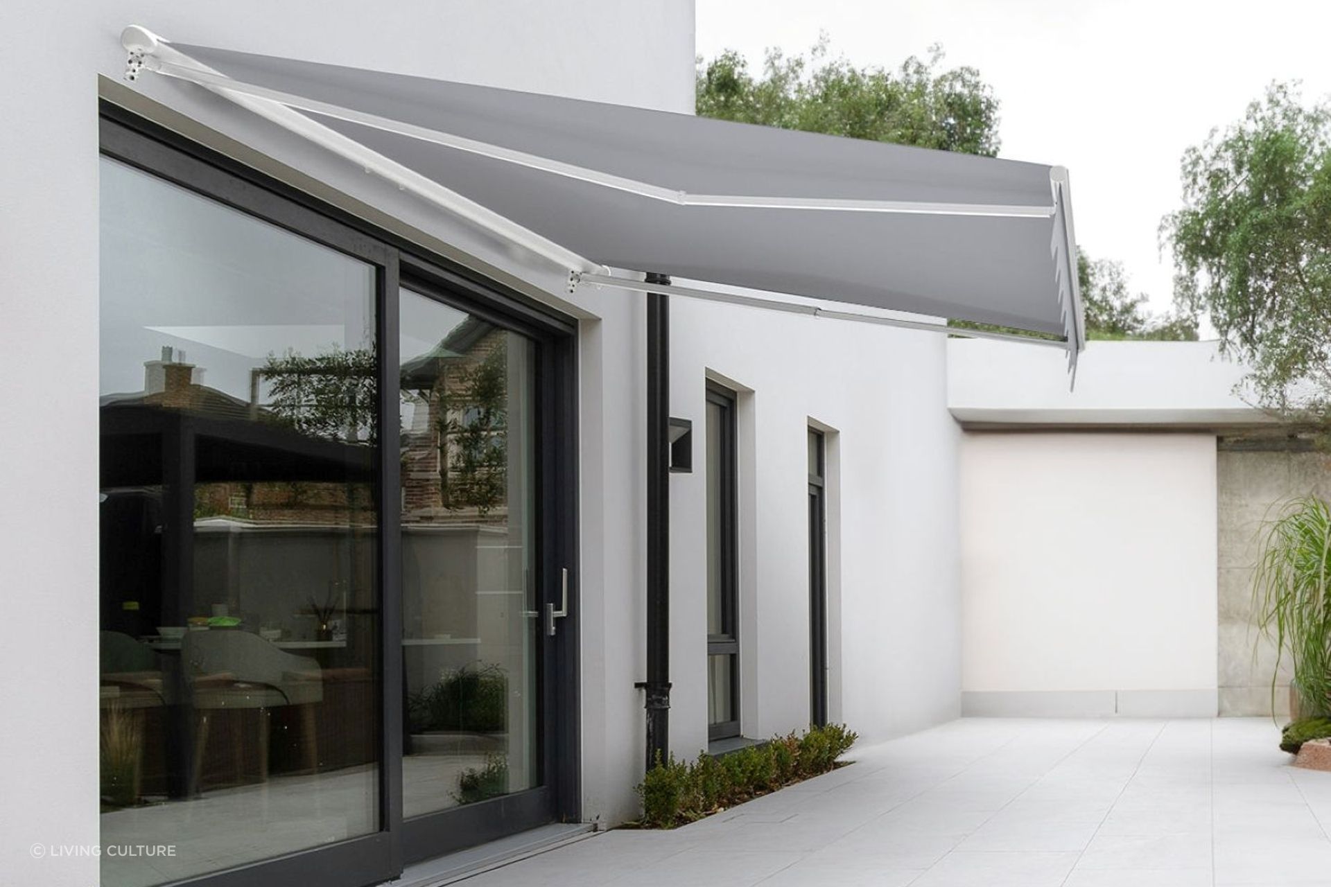 A stylish Custom Retractable Awning from Living Culture that completely frees up floor space while offering shade.