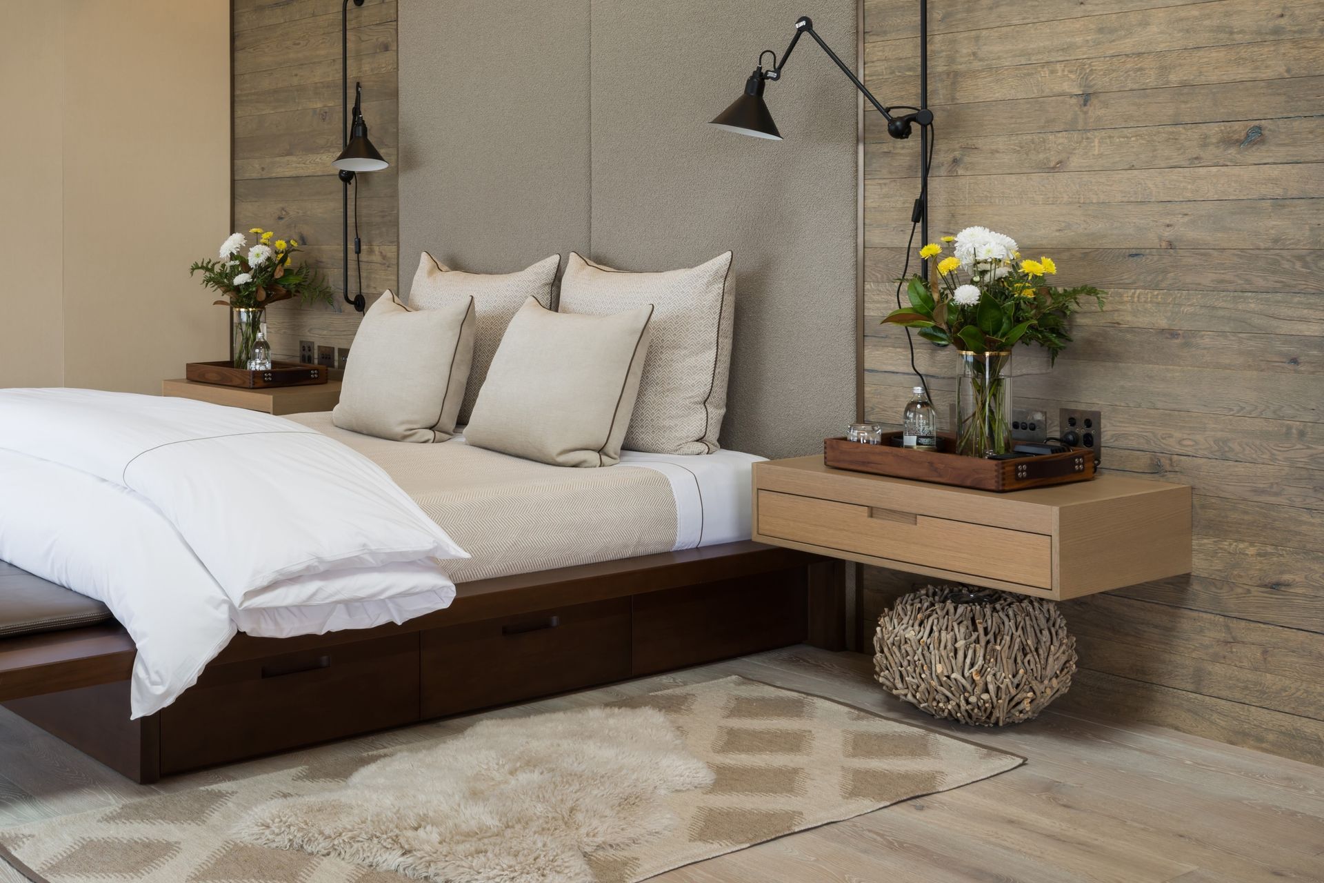 Wall mounted bedside tables, like these custom made bedside tables by DBJ, free up floor space for other items of decor.