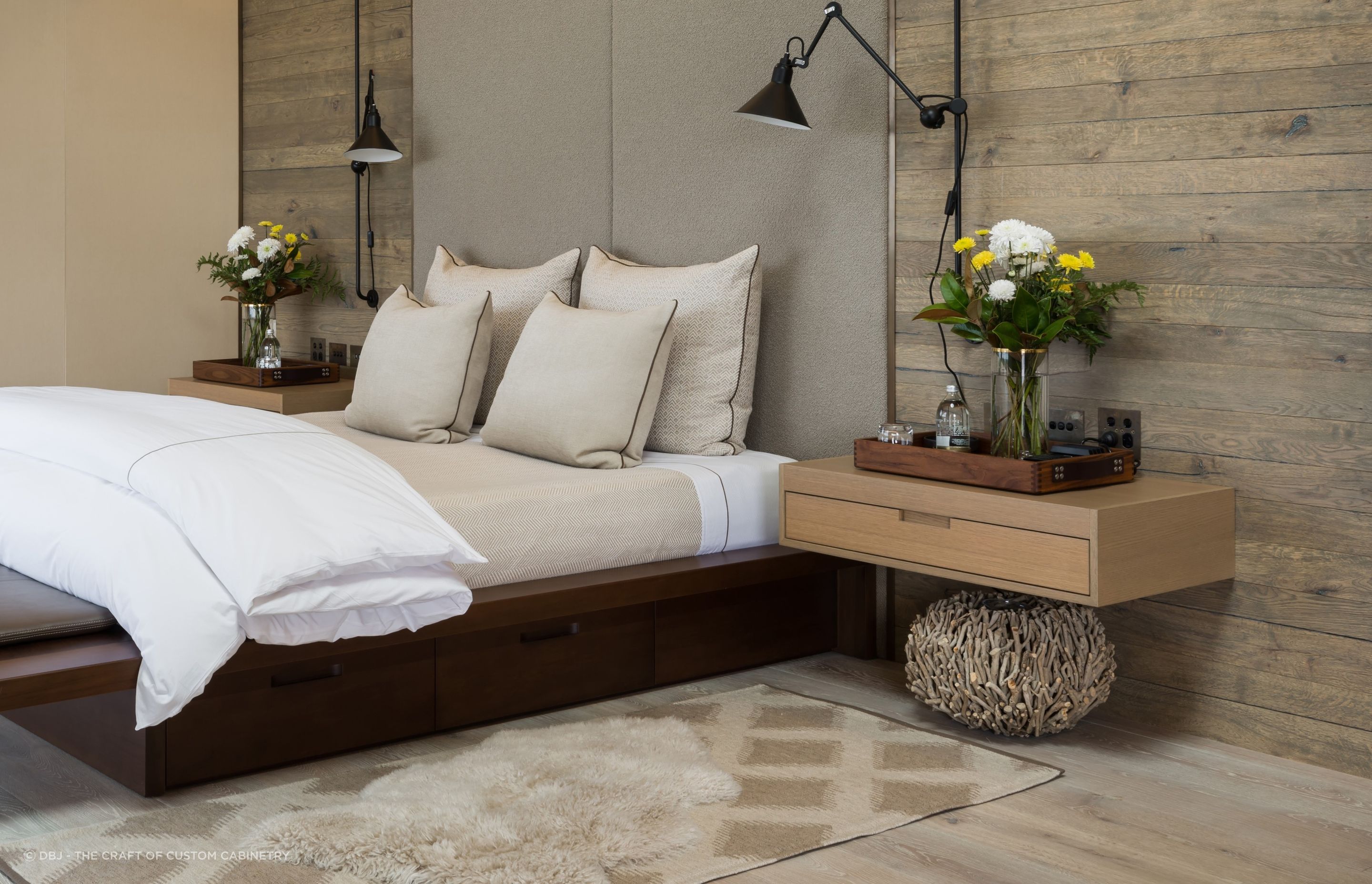Wall mounted bedside tables, like these custom made bedside tables by DBJ, free up floor space for other items of decor.