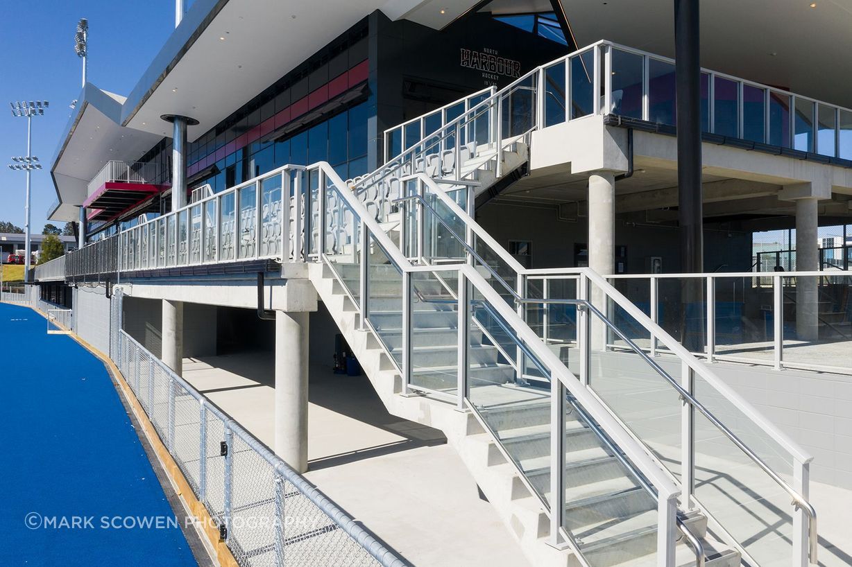 The main stand at the National Hockey Centre has capacity for 450 spectators so the UNEX X3000 series was specified as it has the highest load rating of any aluminium balustrade—capable of withstanding greater than 3kN of sustained force, or the same as if all 450 spectators were to hit the balustrade at the same time.