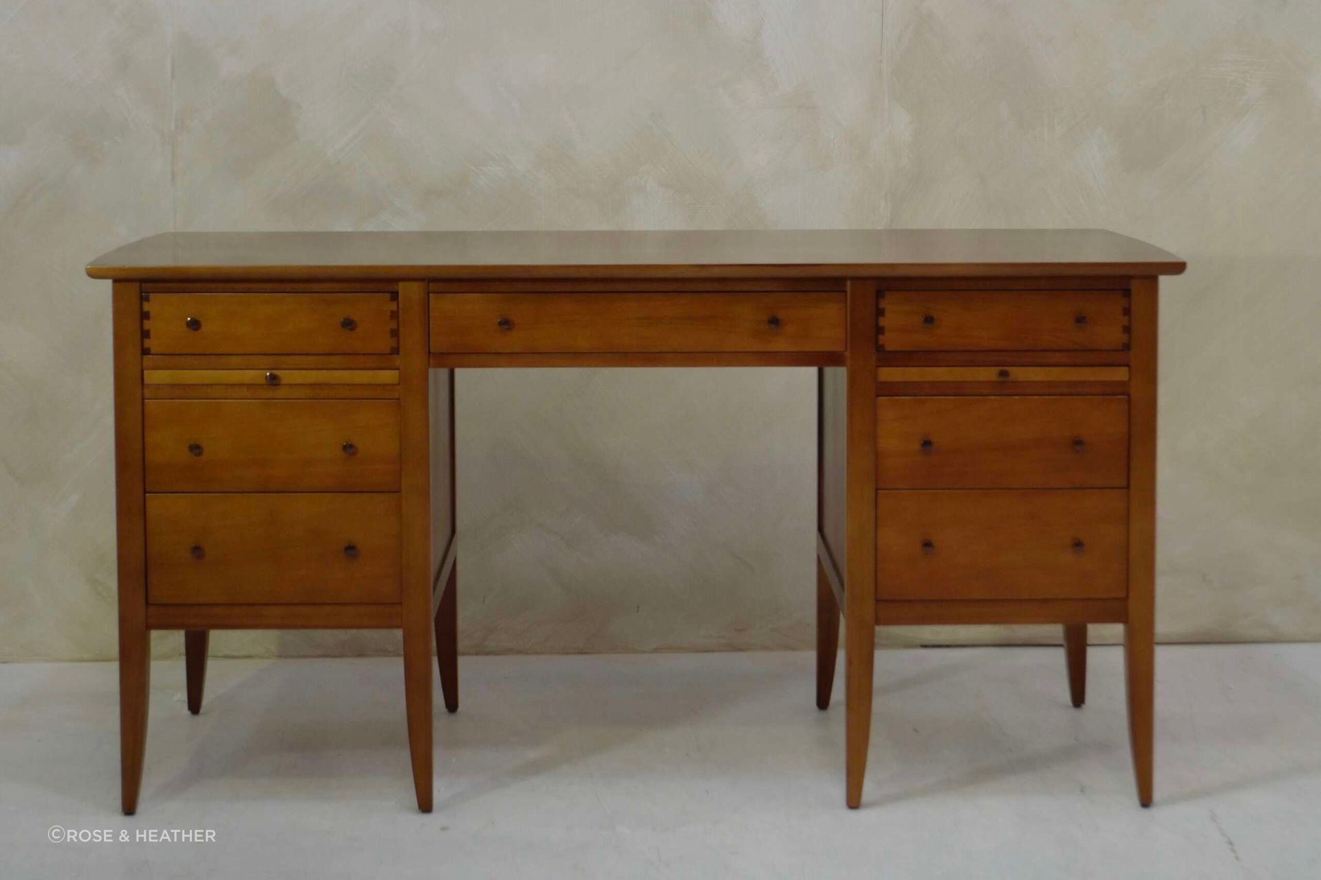The Tumblehome Desk is made-to-order and available in kauri or ash.