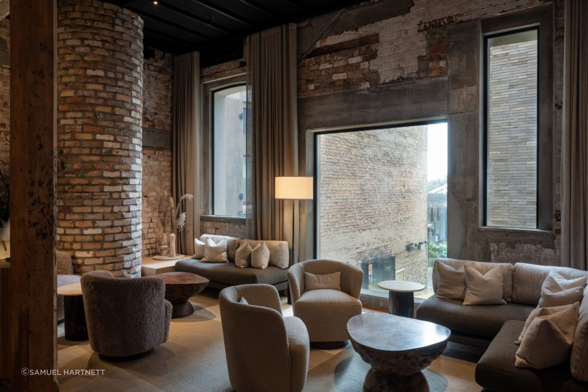 The Libraries bar features a variety of lighting styles, with well-placed floor lamps creating depth and interest in the space.