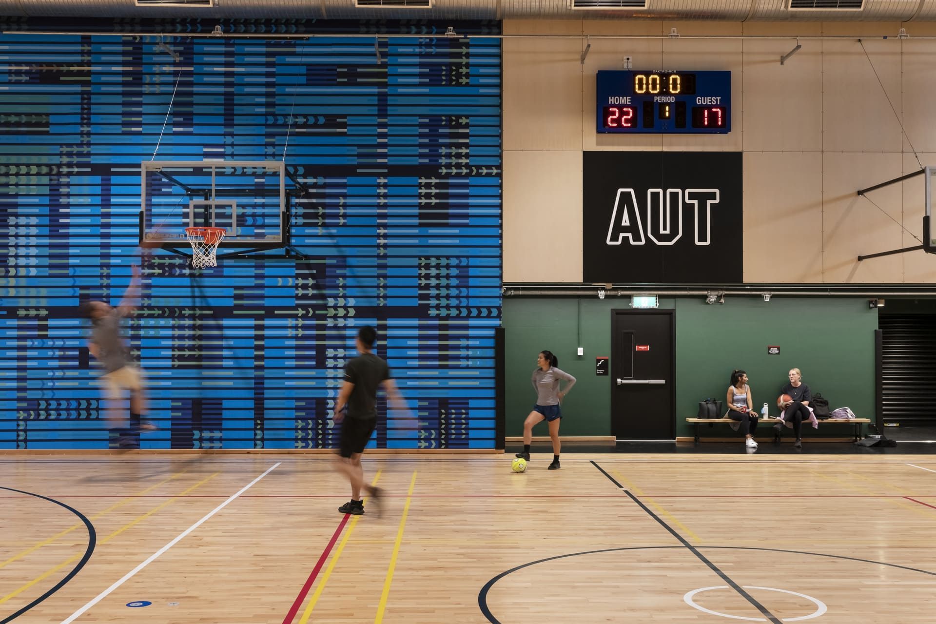A series of solid and perforated fire-rated MDF panels – to meet acoustic, fire and impact resistance criteria for the gym – were specified and finished with the native timber.