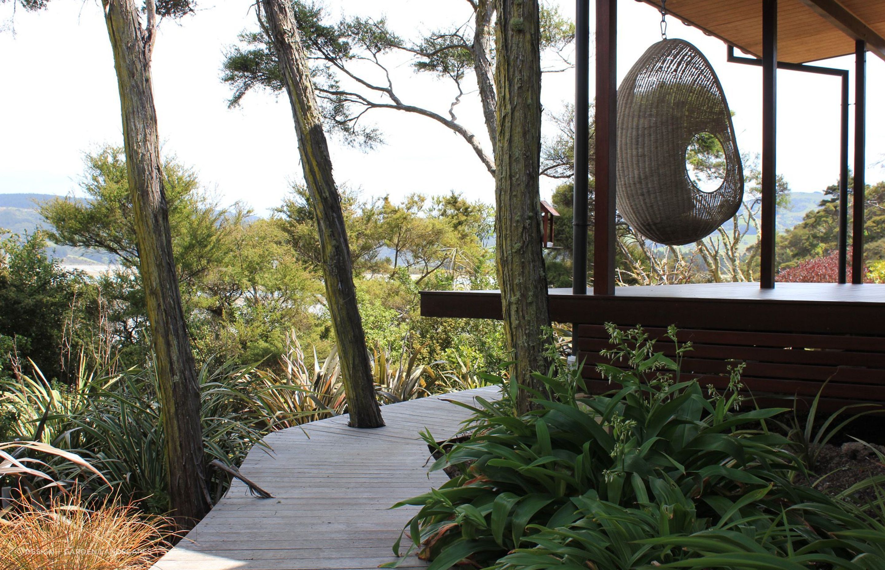 Native plants naturally give a garden that quintessential Kiwi look, beautifully done in this award-winning garden in Dunedin with rengarenga, harakeke and more.