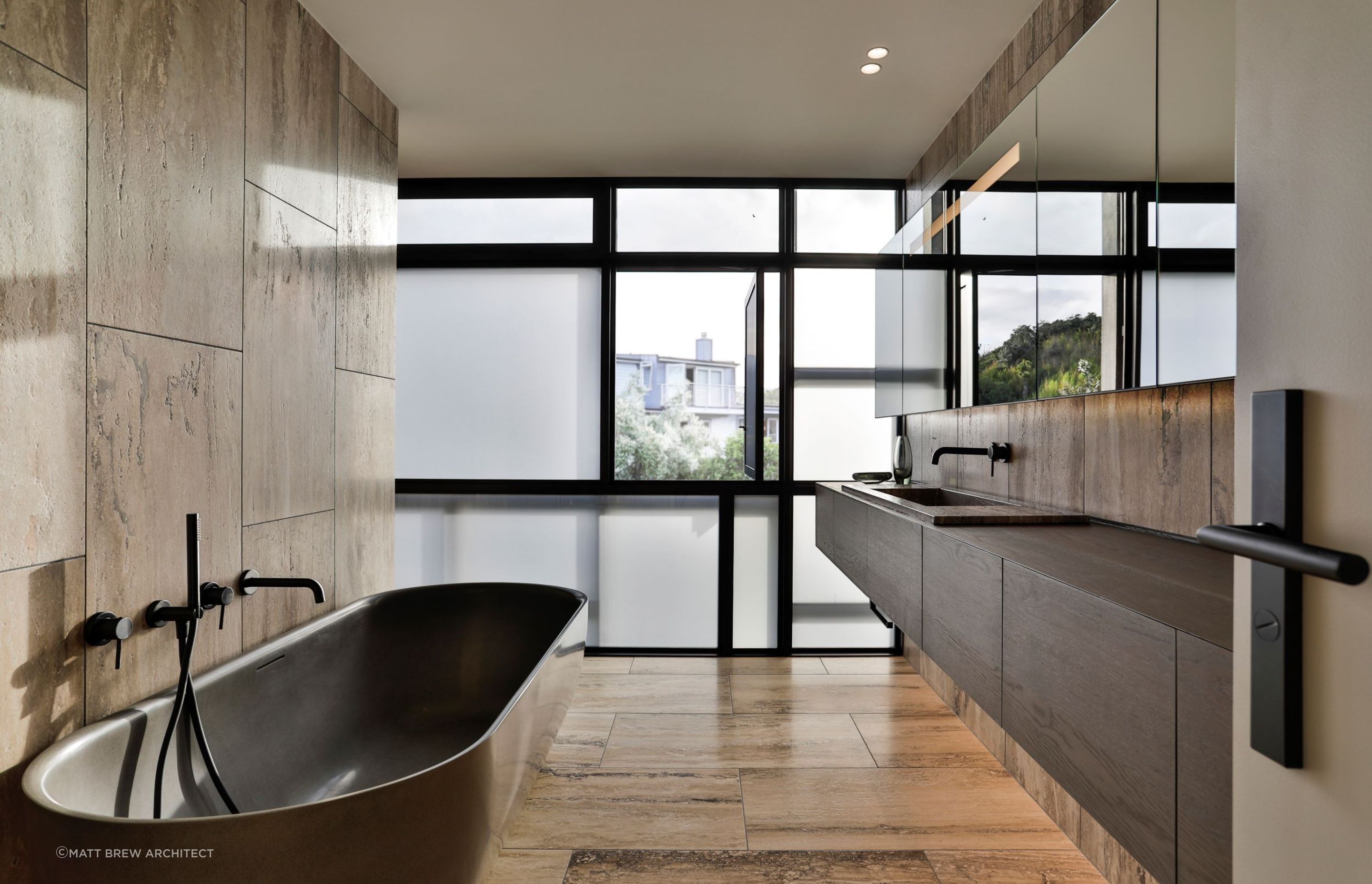 Earthy tones create instant warmth in this sophisticated bathroom in Eastern Beach.