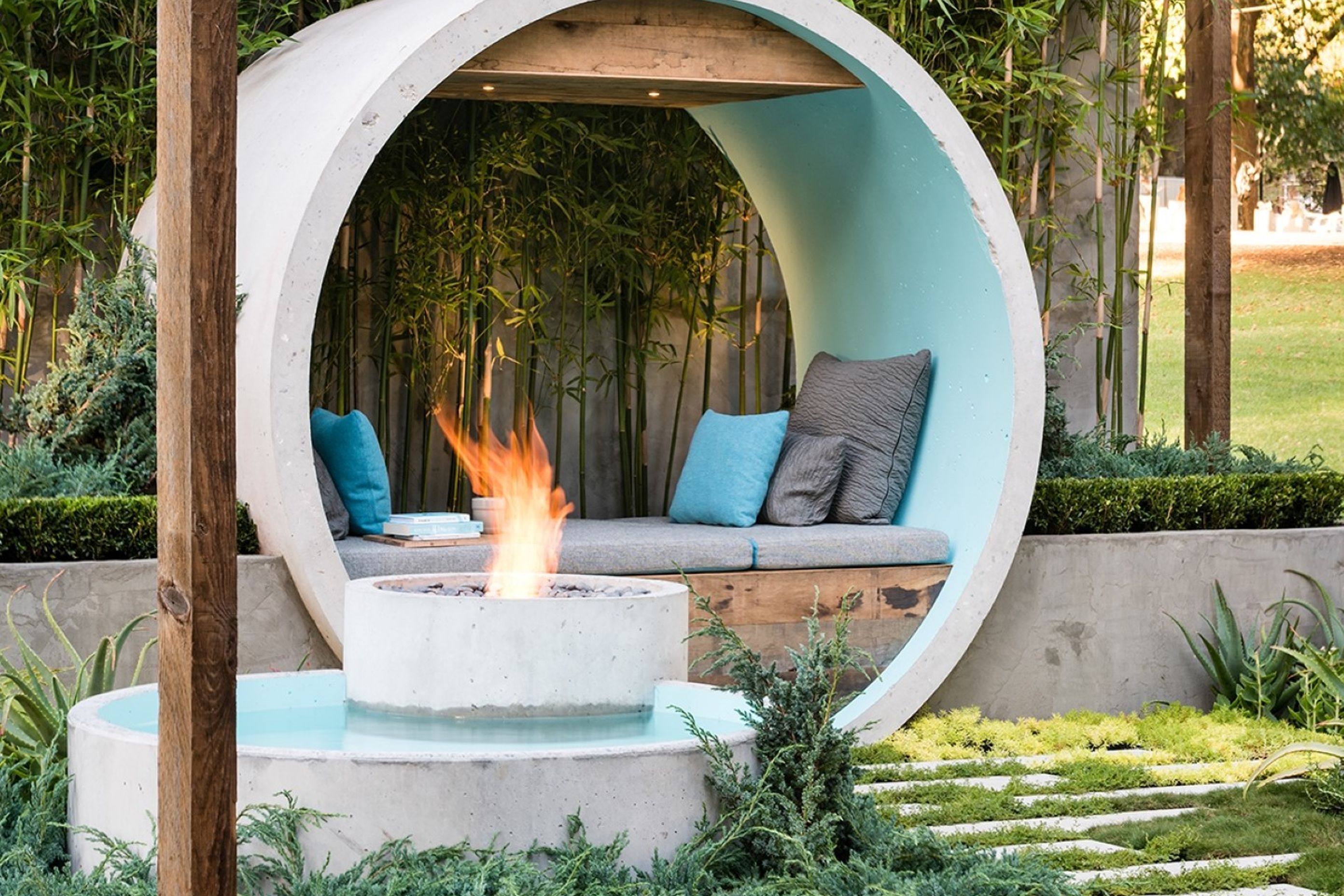 Incorporating your fire pit into a water feature, stylishly done here with the EcoSmart AB8 Ethanol Fireplace, can result in a stunning focal point for your backyard.