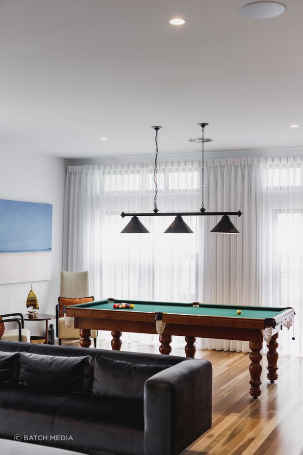 This games room by Black Lines Concept brings together the clients' love of music and game playing.