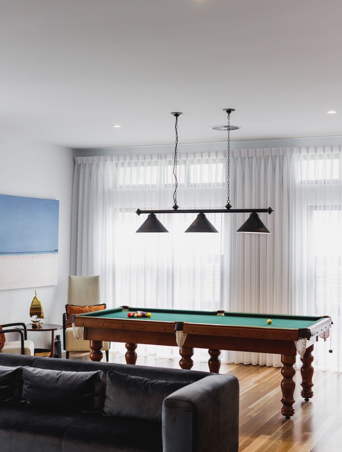 This games room by Black Lines Concept brings together the clients' love of music and game playing.