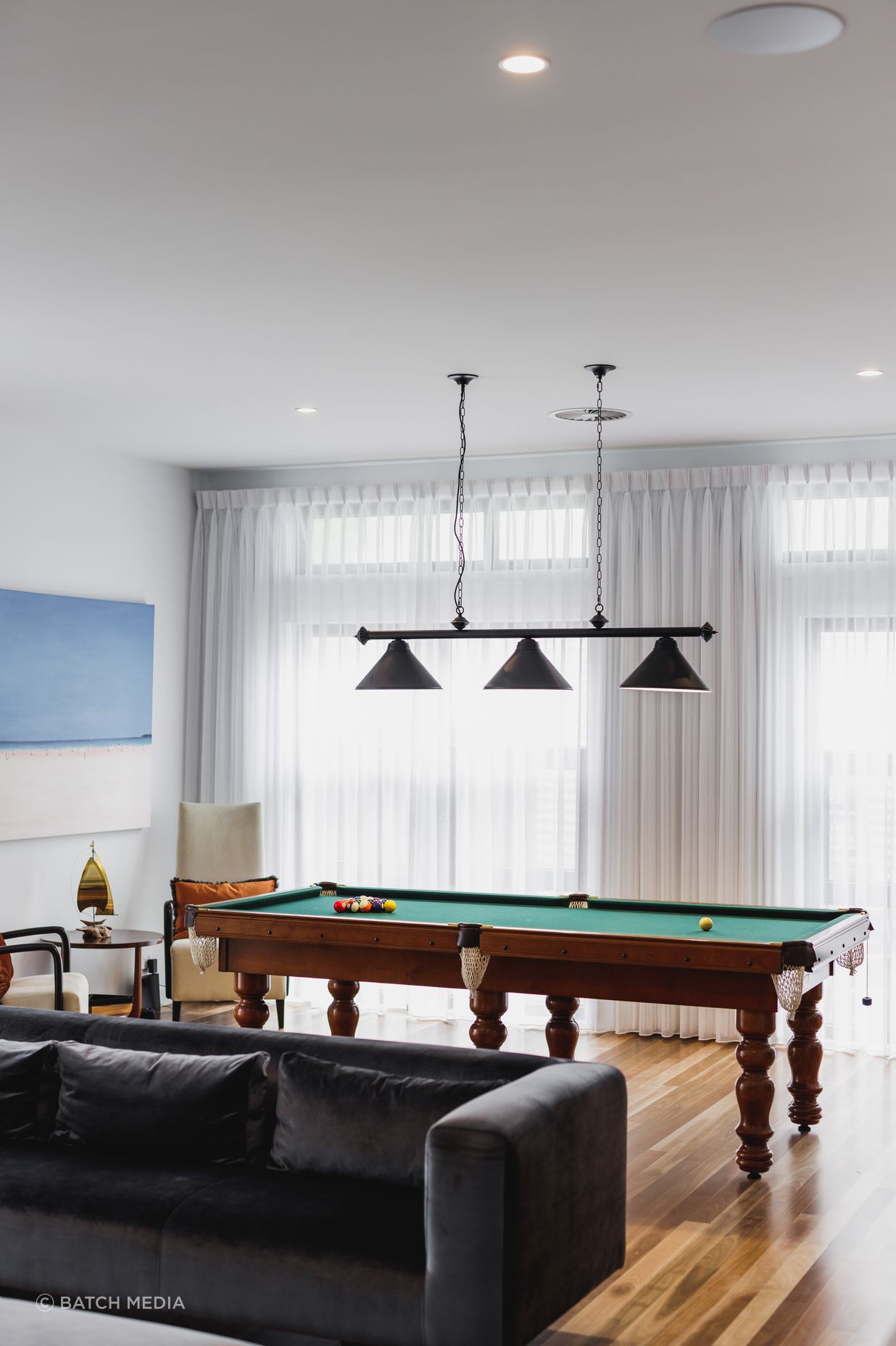 This games room by Black Lines Concept brings together the clients' love of music and game playing.