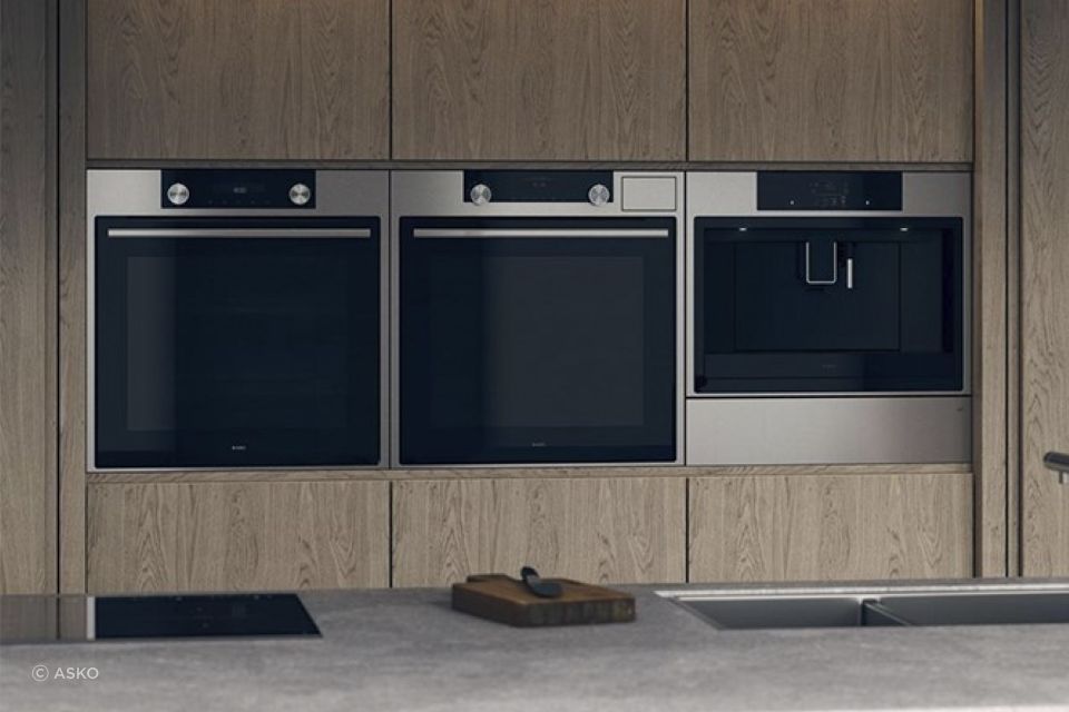 Sleek solutions, like the Elements Warming Drawer from ASKO (far right), seamlessly blend into a kitchen.