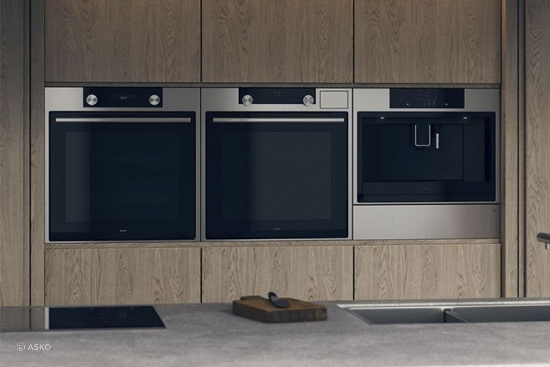 Sleek solutions, like the Elements Warming Drawer from ASKO (far right), seamlessly blend into a kitchen.