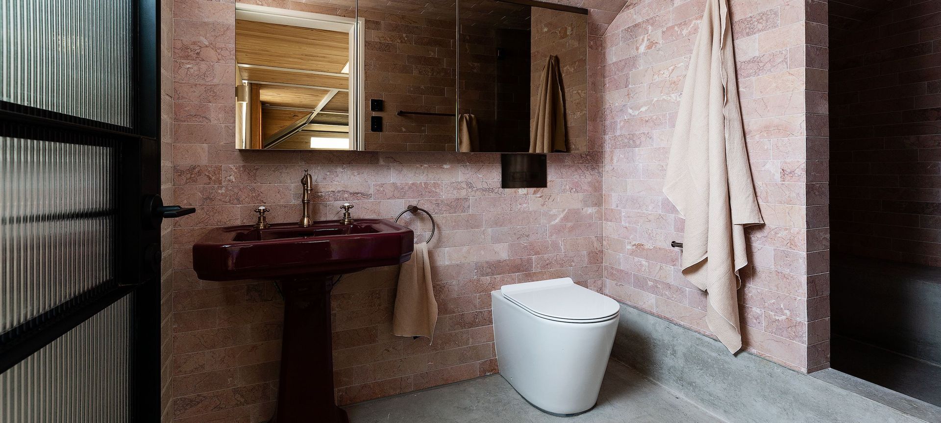 Architecture and interiors by Alexander &CO.  Build by Fairweather Constructions. This blush toned bathroom features Expella's Milu Odourless toilet Shadowline Diffuser Pro, Linear Slot grille
 and Inline ventilation systems.