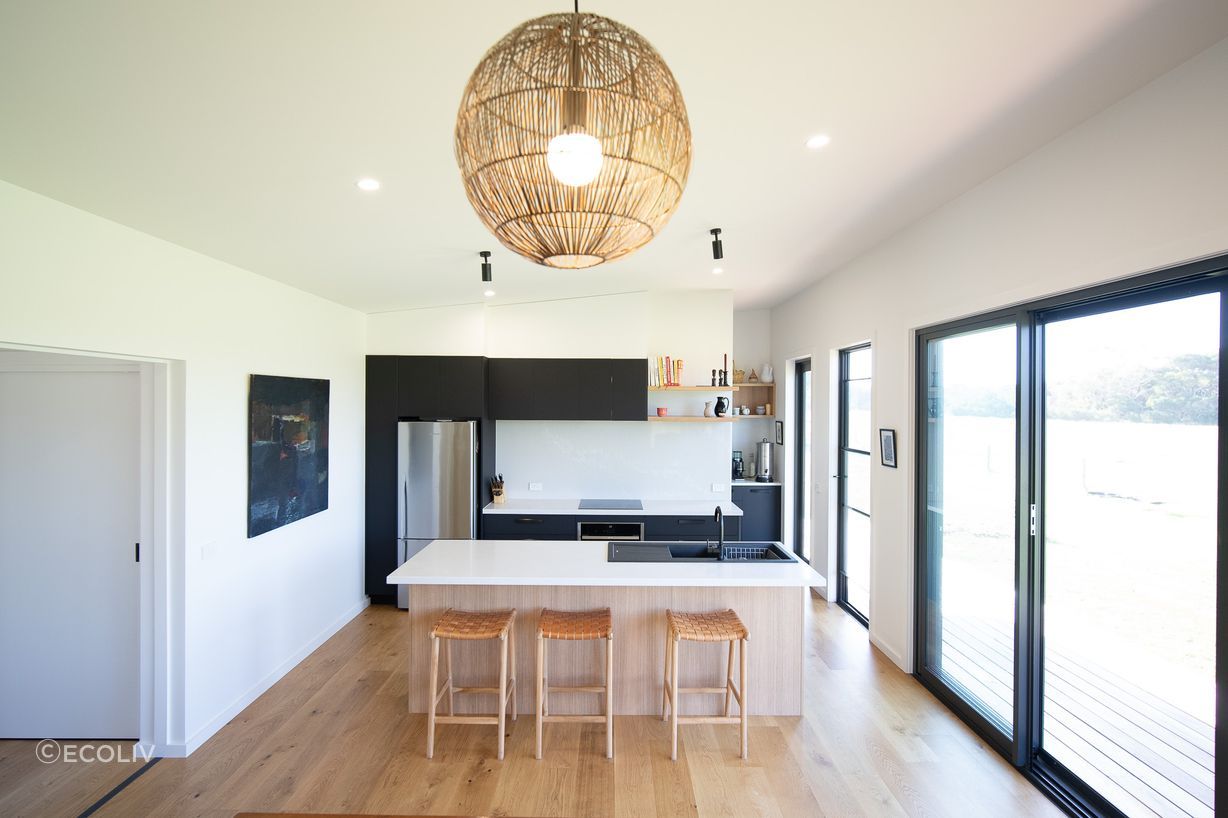 The contemporary kitchen of the Riverland Project operates by capturing rainwater and treating and disposing of wastewater with an on-site gravity-fed system