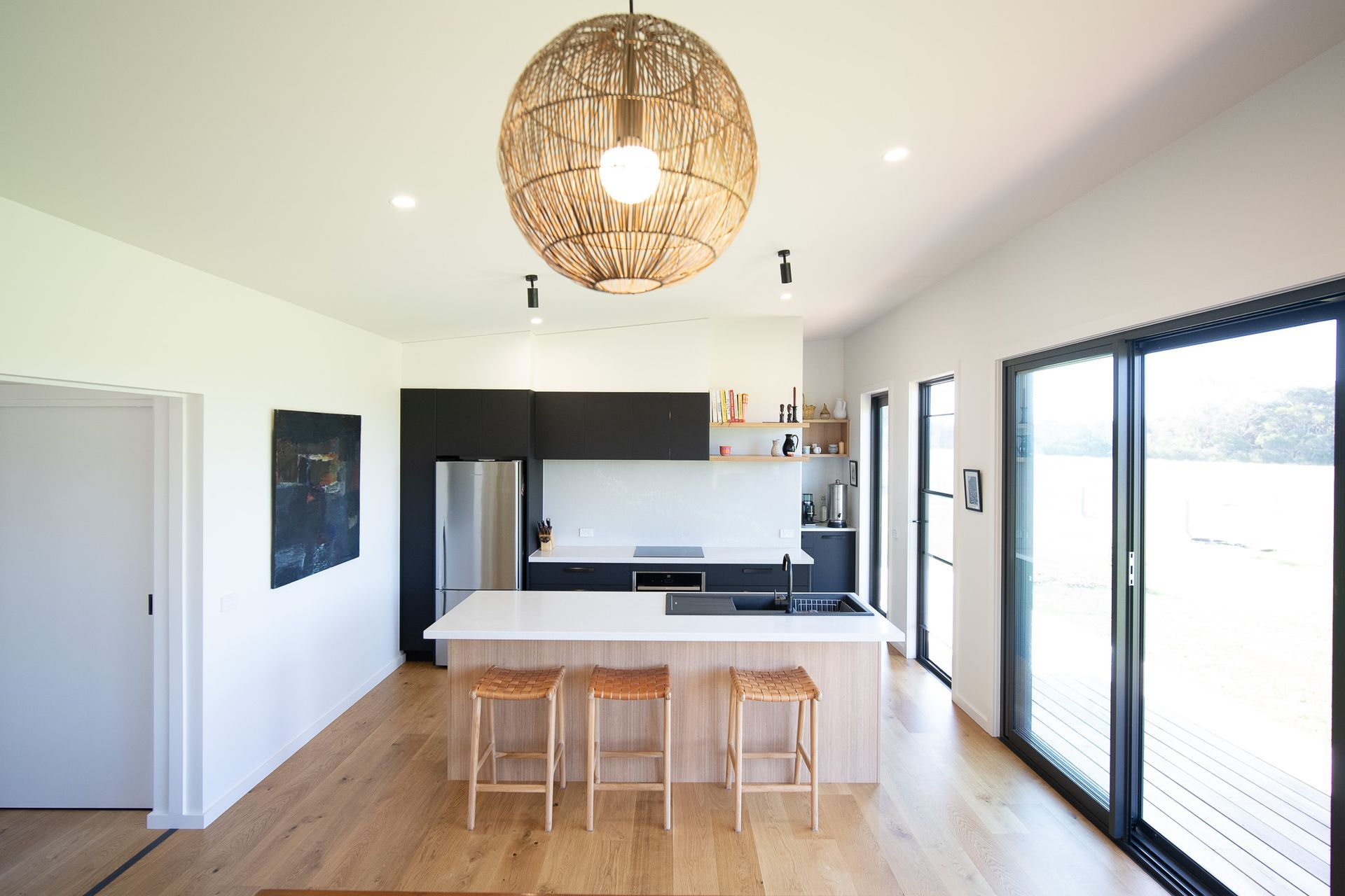 The contemporary kitchen of the Riverland Project operates by capturing rainwater and treating and disposing of wastewater with an on-site gravity-fed system