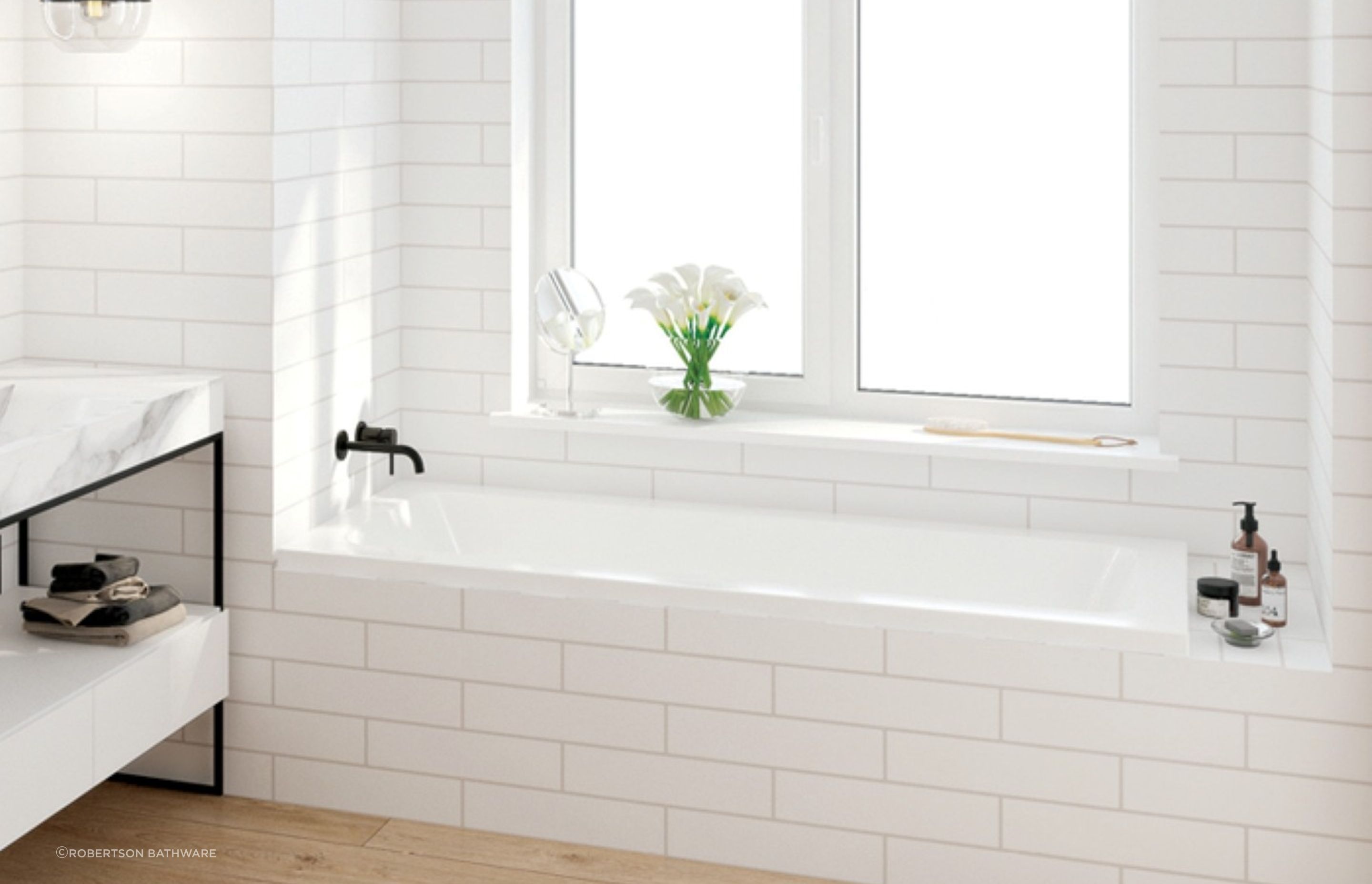 A sleek example of a drop in bath from the Elementi Collection by Robertson Bathware.