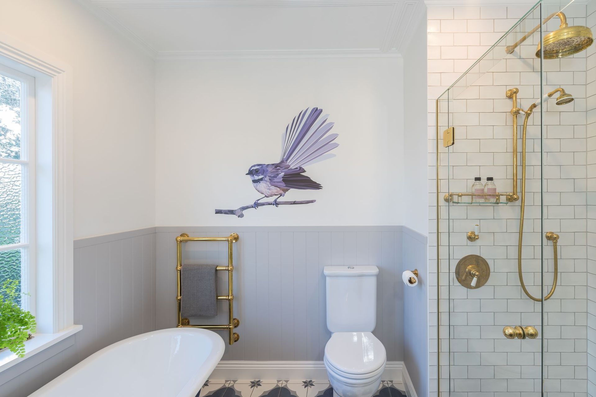 A pleasant wall decal, like the Piwakawaka in this bathroom renovation in Epsom, can make the space more comfortable for kids — Photography: Kallan Mac Leod