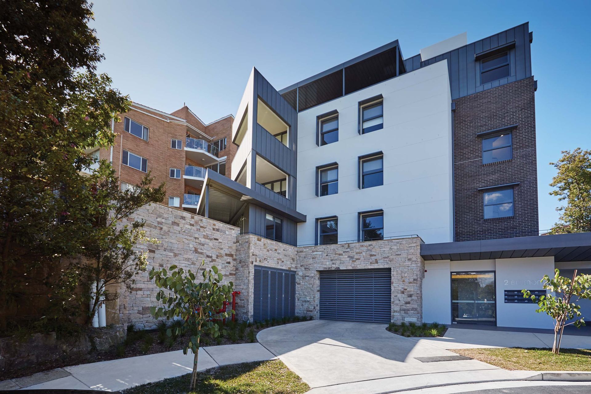 Natural stone cladding is a versatile cladding choice for outdoor applications such as a garage. Featured product: Estate Organic Stone Wall Cladding.