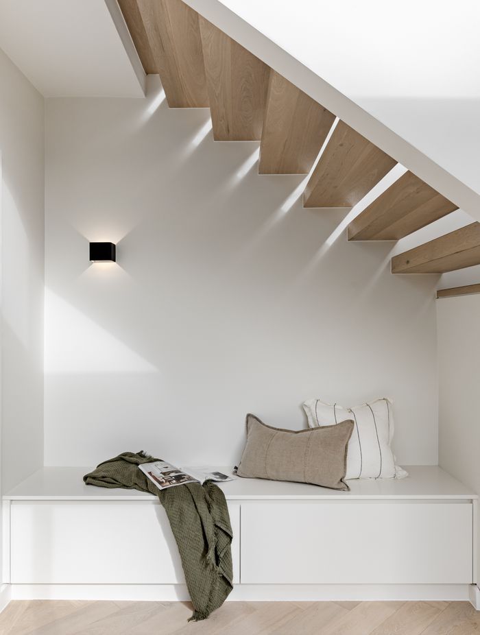 Spaces of relaxation have been elegantly included in the design. An example is this 
reading nook under the stairs.