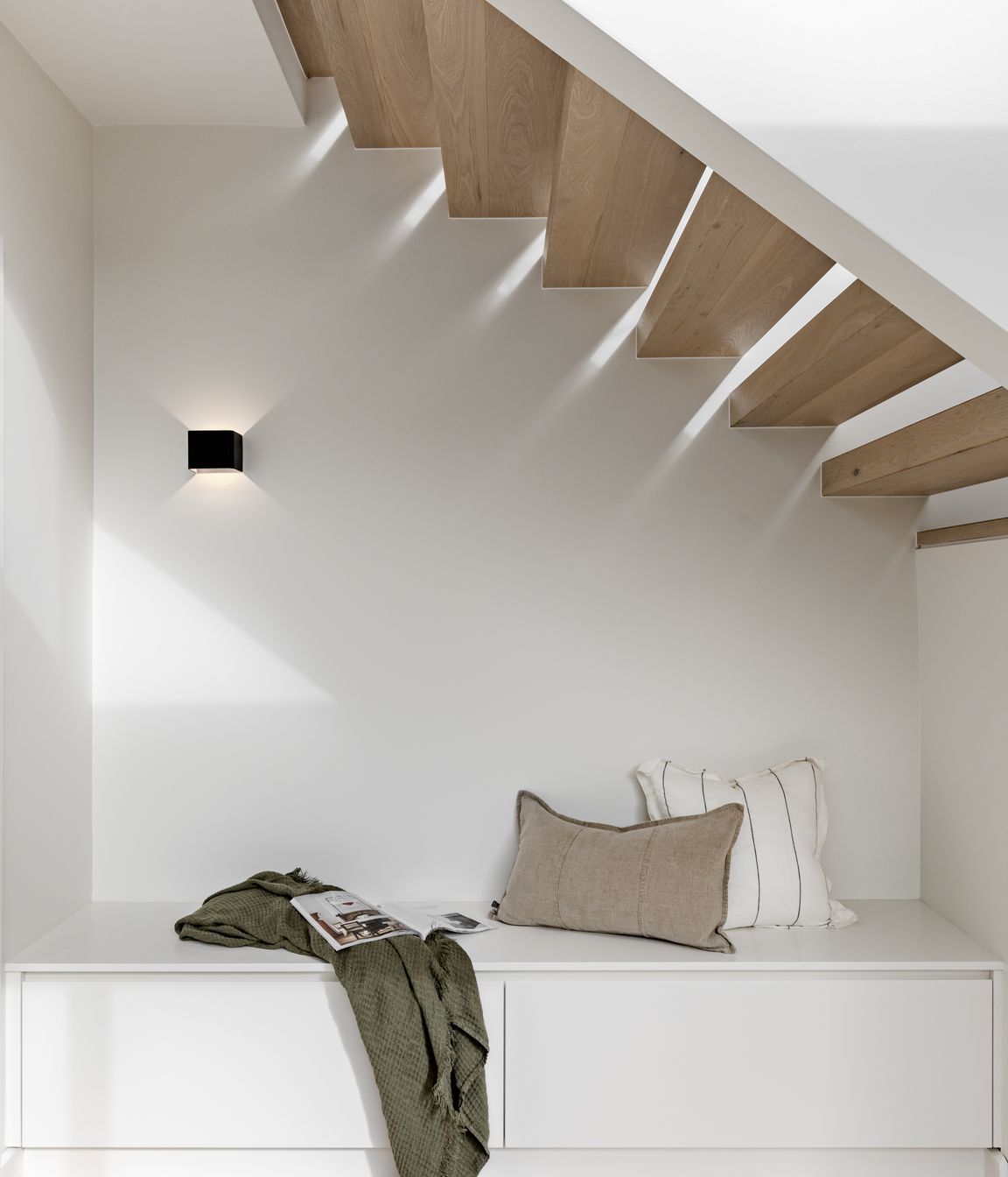 Spaces of relaxation have been elegantly included in the design. An example is this 
reading nook under the stairs.