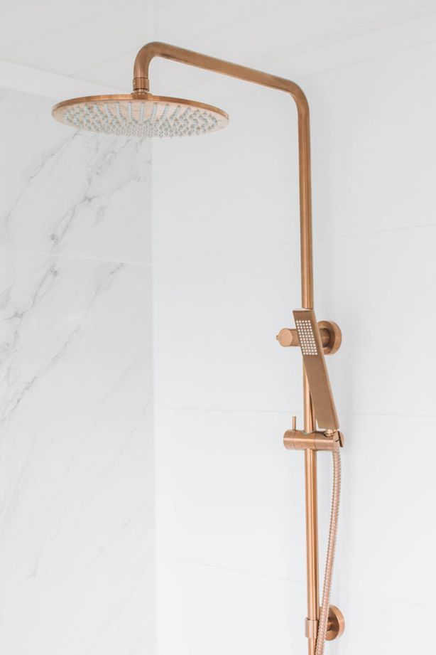 A rail shower head or set can typically be adjusted along a vertical bar. Featured product: ABI Finley Shower Rail Set.