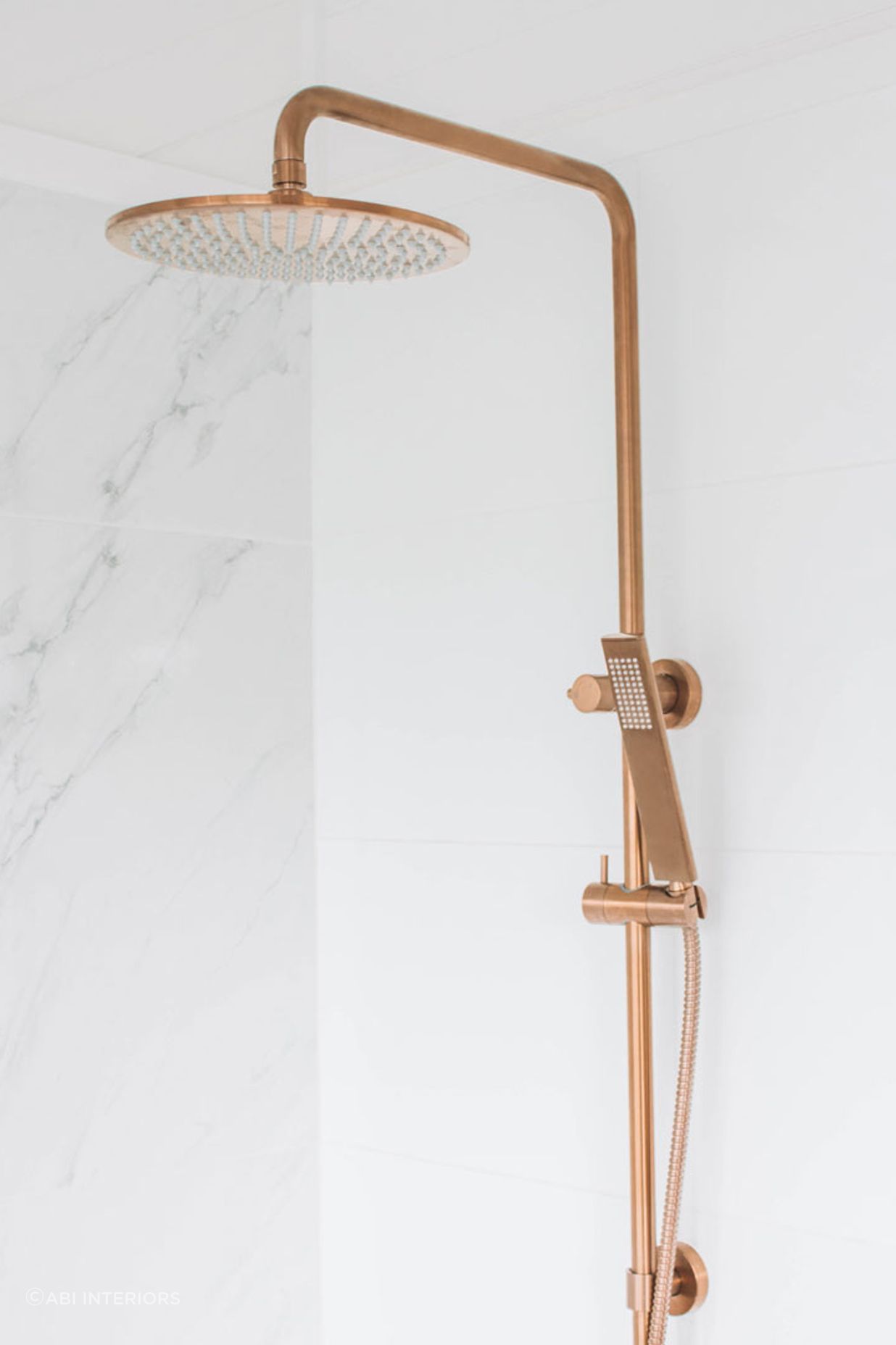 A rail shower head or set can typically be adjusted along a vertical bar. Featured product: ABI Finley Shower Rail Set.