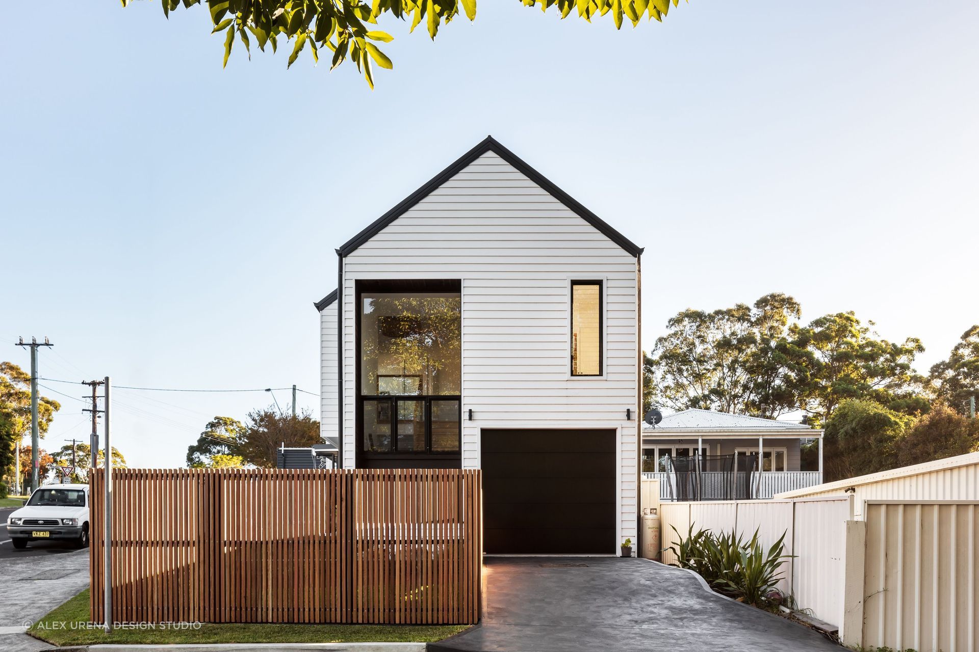 Picket fence surrounding modern home