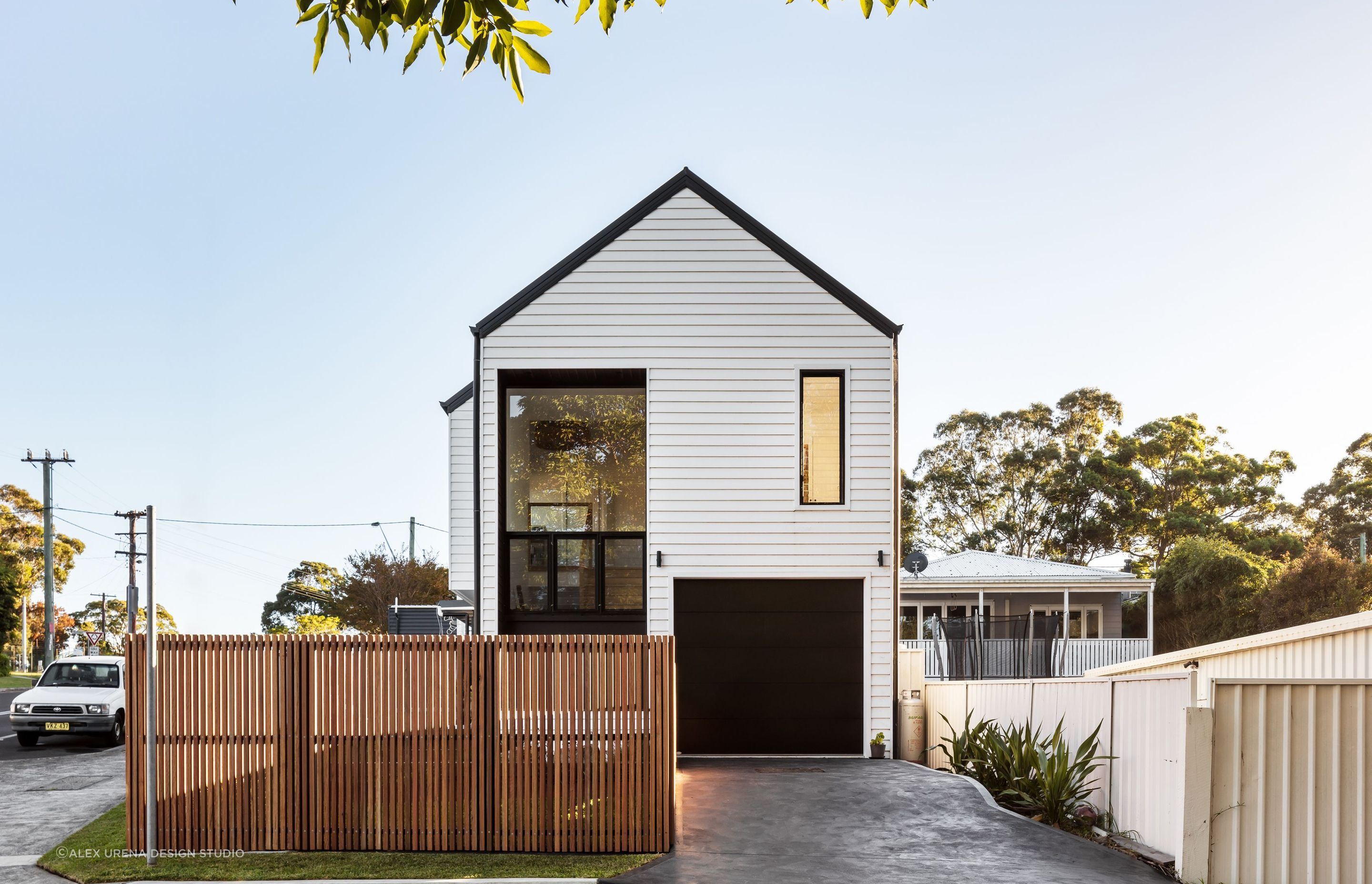Picket fence surrounding modern home
