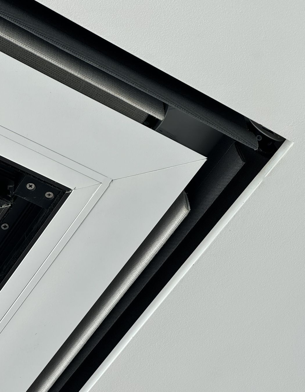 Recessed Flushboxes are integrated into the ceiling, creating a perfectly seamless space.