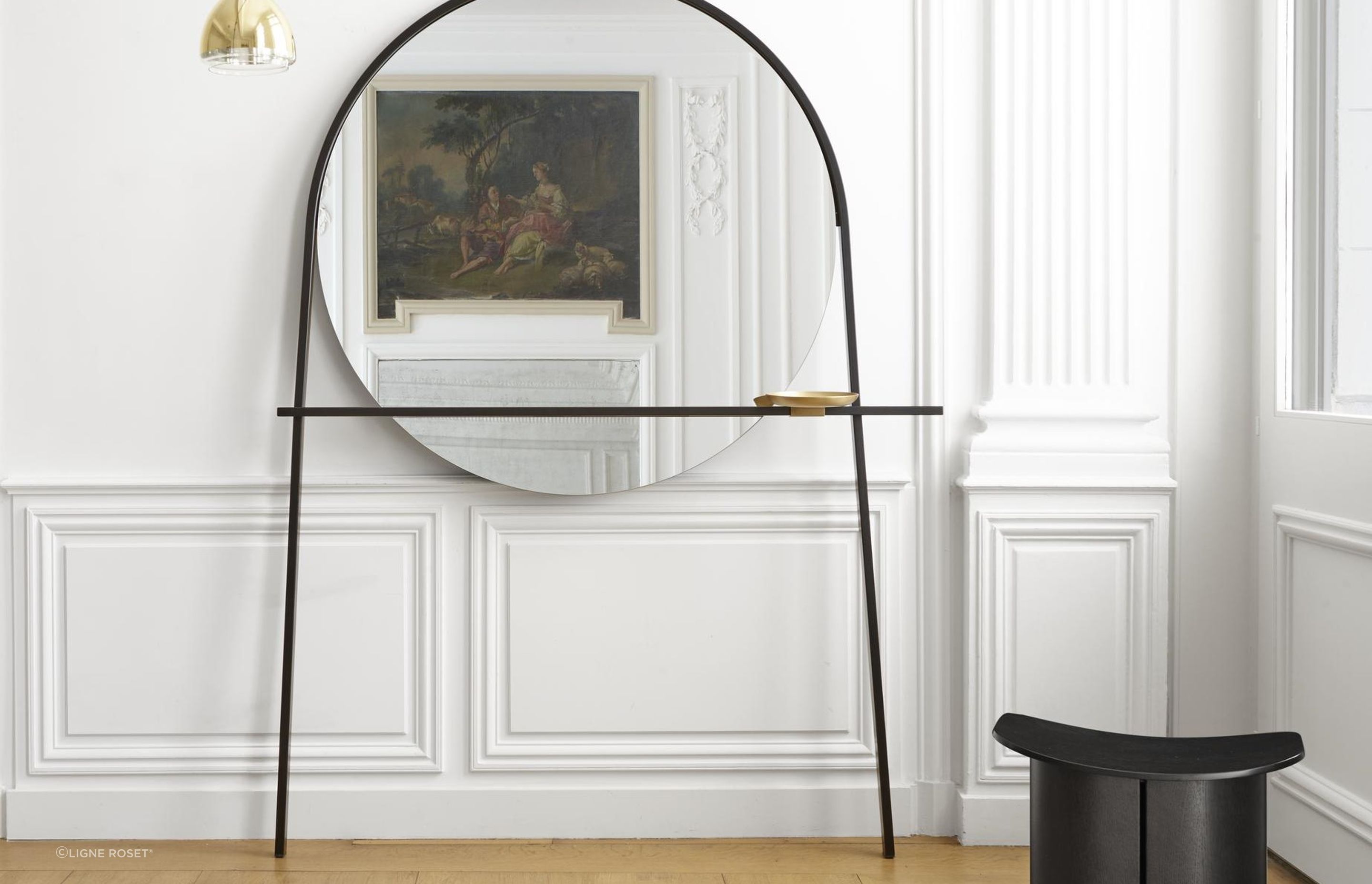 Art on one wall, mirror and art on the other, executed with style here using the Geoffrey Mirror Clothes Stand by Alian Gilles.